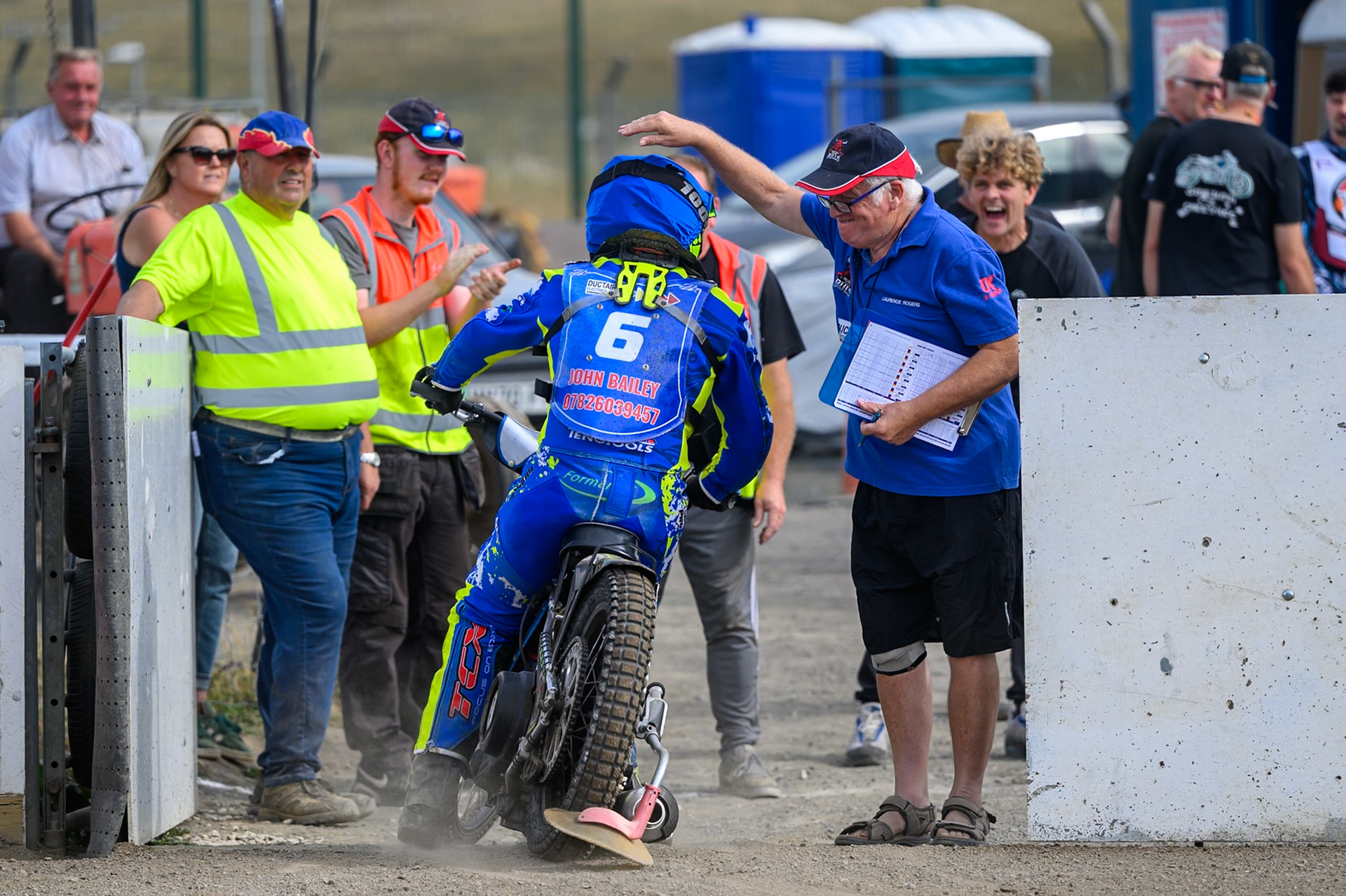 Laurence Rogers, Team Manager of Buxton Bulls ri\ congratulates Will Boraston of Buxton Bulls  on his best performance of the meeting during the WSRA National Development League match  between Buxton Bulls and Middlesborough Tigers at Hi-Edge Speedway, Buxton on Sunday 16th August 2026. (Photo: Ian Charles | MI News)