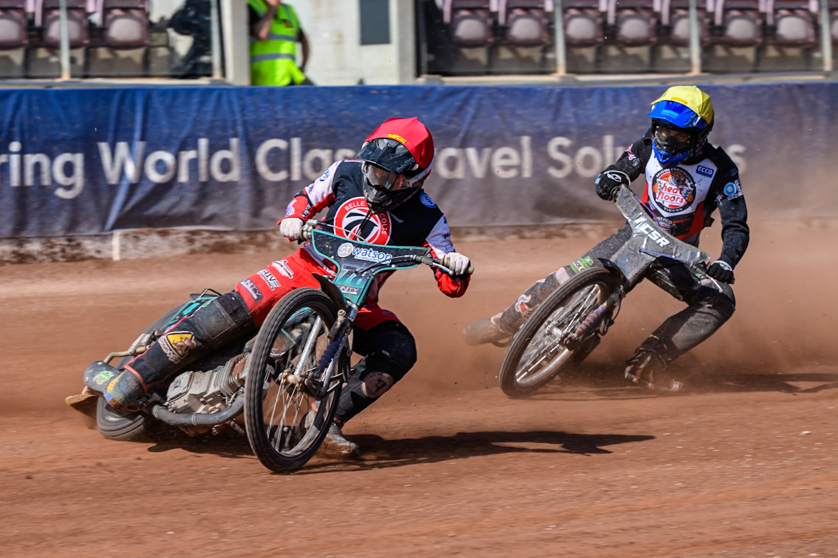 Mason Watson of Belle Vue Colts  in Red leading Charlie Southwick of Middlesborough Tigers  in Yellow during the WSRA National Development League match between Belle Vue Colts and Middlesbrough Tigers at the National Speedway Stadium, Manchester on Sunday 10th August 2025. (Photo: Mark Fletcher | MI News)