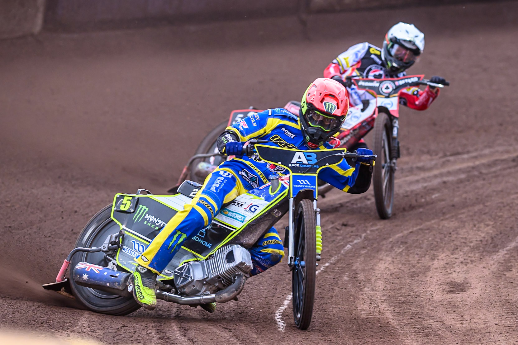 Chris Holder of Sheffield Tigers  in Red leading Dan Bewley of Belle Vue Aces   in Whiteduring the Rowe Motor Oil Premiership match between Sheffield Tigers and Belle Vue Aces at Owlerton Stadium, Sheffield on Monday 11th August 2025. (Photo: Ian Charles | MI News)