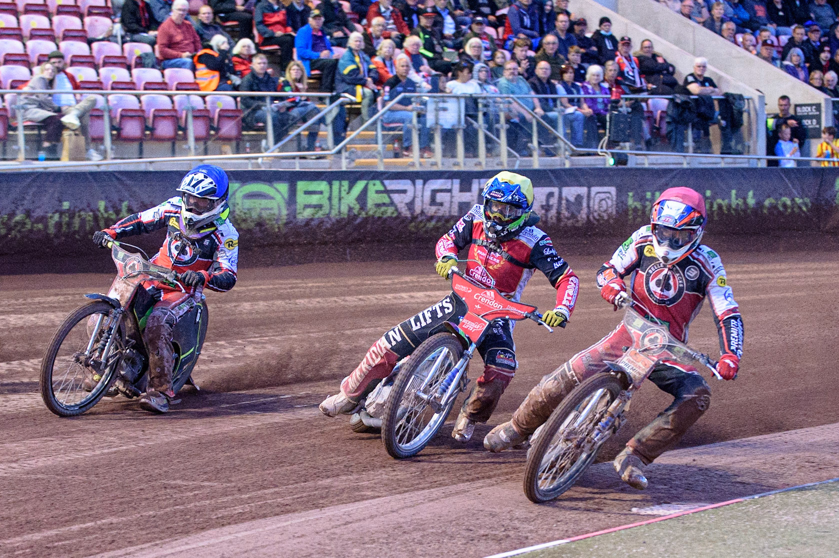 MANCHESTER, UK. AUG 9TH  Steve Worrall (Red) inside Hans Andersen (Yellow) and Tom Brennan  (Blue) during the SGB Premiership match between Belle Vue Aces and Peterborough at the National Speedway Stadium, Manchester on Monday 9th August 2021. (Credit: Ian Charles | MI News)