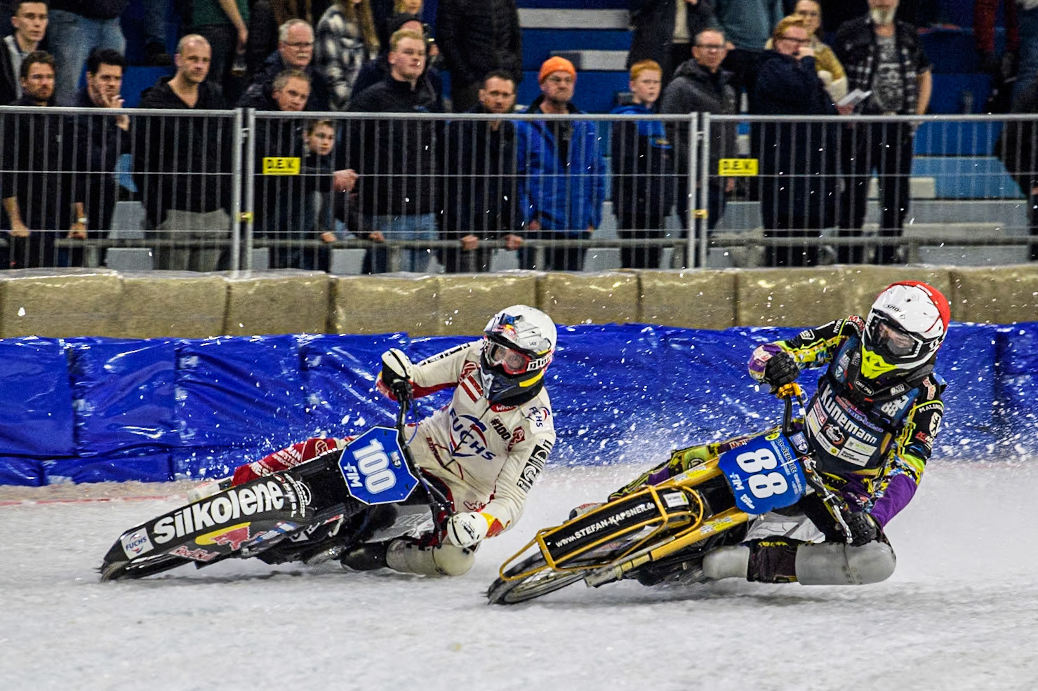 Germany's Max Niedermaier (88) in Red rides inside Austria's Franz Zorn (100) in White during the FIM Ice Speedway Gladiators World Championship Final 3 at Ice Rink Thialf, Heerenveen on Saturday 6th April 2024. (Photo: Ian Charles | MI News)
