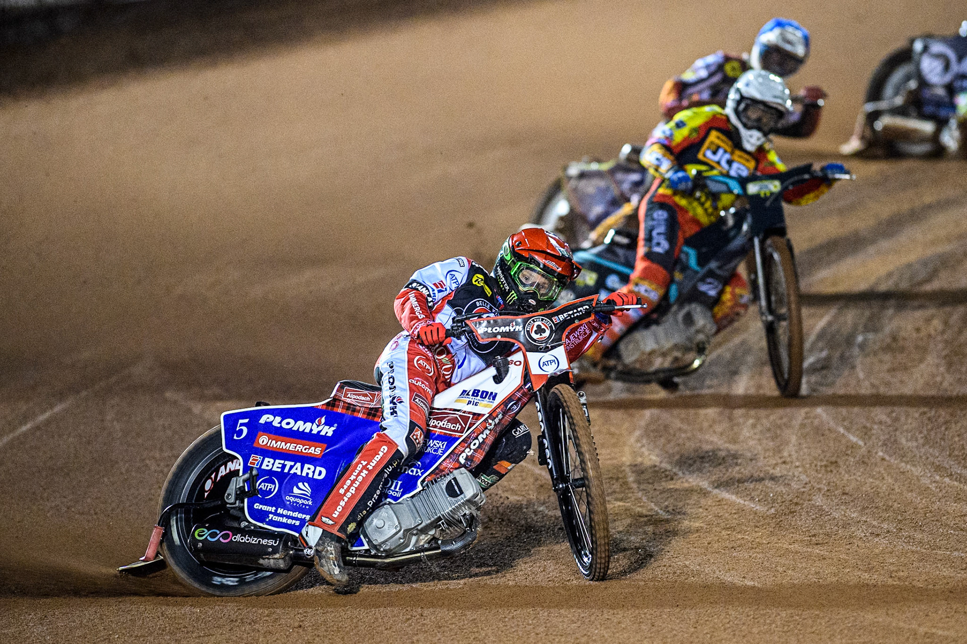 Belle Vue Aces' Dan Bewley  in Red leading Leicester Lions' Ryan Douglas  in White and Belle Vue Aces' Jake Mulford  in Blue during the Rowe Motor Oil Premiership Grand Final 1st Leg between Belle Vue Aces and Leicester Lions at the National Speedway Stadium, Manchester on Monday 23rd September 2024. (Photo: Ian Charles | MI News)