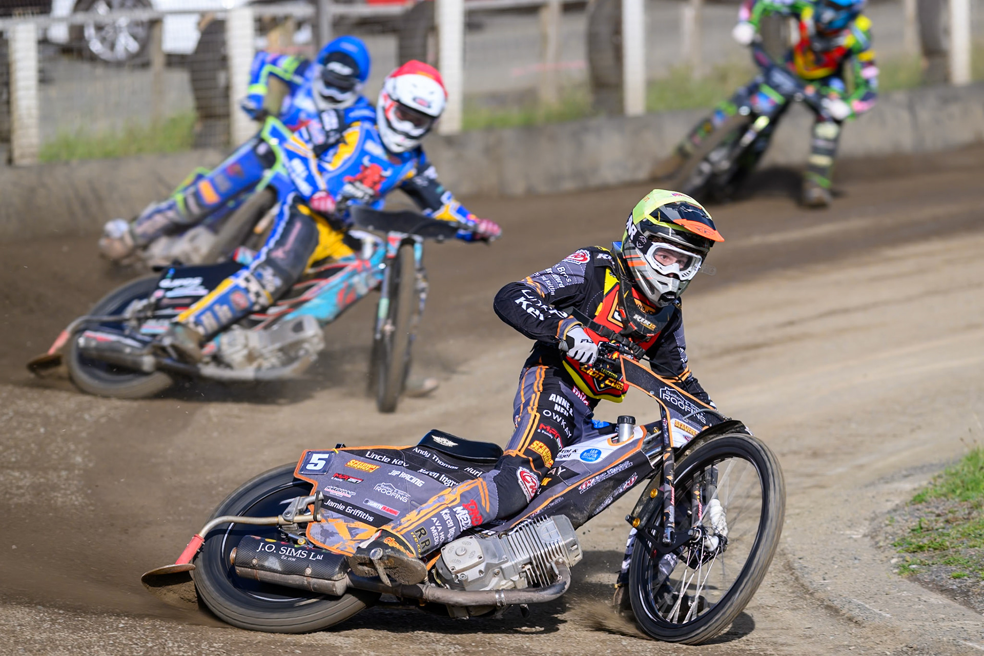 Ryan Ingram of Leicester Lion Cubs   in Yellow leading Alfie Bowtell of Buxton Bulls  in Red, Arran Butcher of Buxton Bulls   in Blue and Harrison Rogers, Guest rider for Leicester Lion Cubs in White during the WSRA National Development League match between Buxton Bulls and Leicester Lion Cubs at Hi-Edge Speedway, Buxton on Sunday 4th October 2026. (Photo: Ian Charles | MI News)