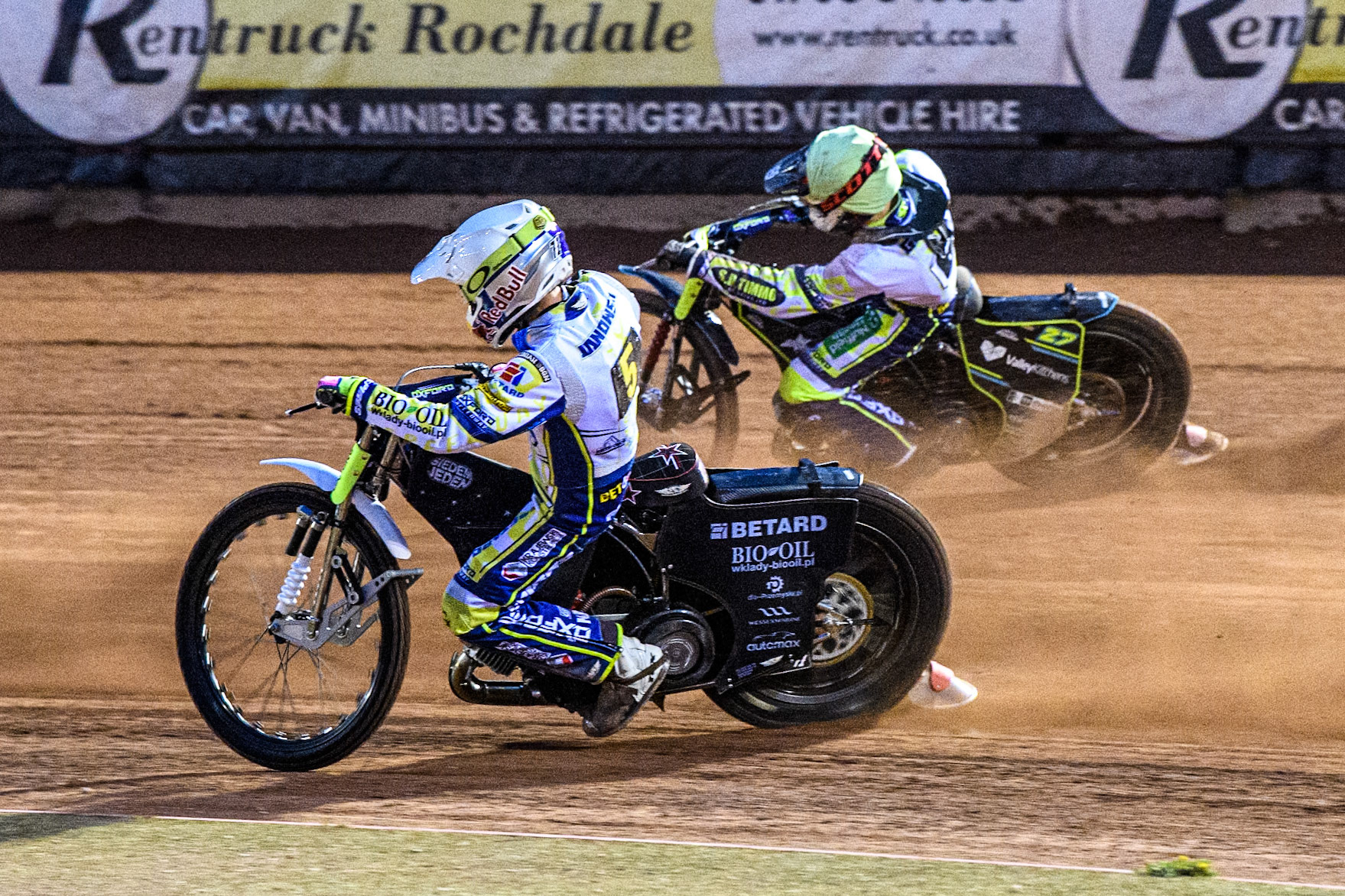 Oxford Spires' Maciej Janowski in White rides inside team mate Francis Gusts in Yellow during the Rowe Motor Oil Premiership match between Belle Vue Aces and Oxford Spires at the National Speedway Stadium, Manchester on Monday 14th April 2025. (Photo: Ian Charles | MI News)