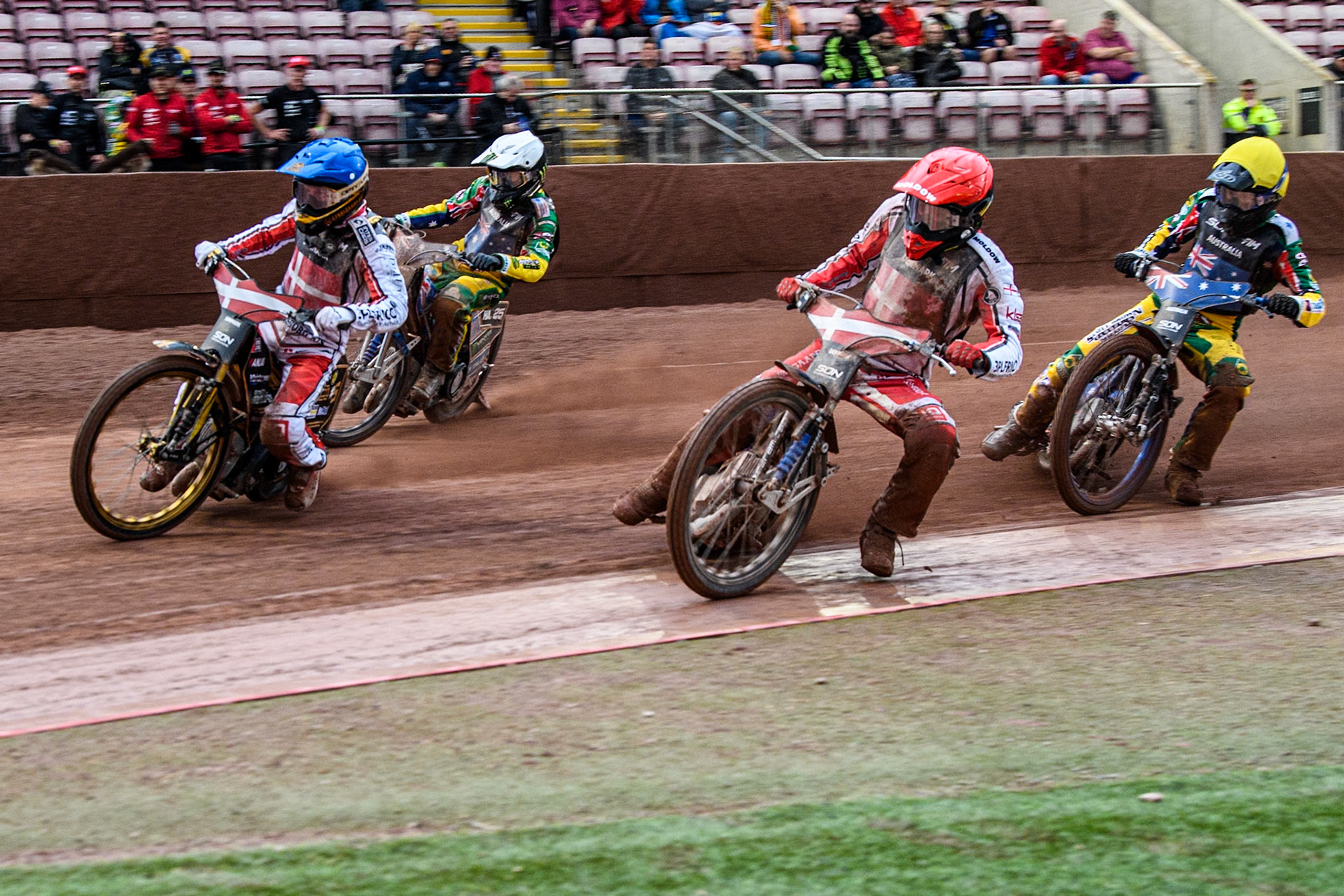 Denmark v Australia: Rasmus Jensen of Denmark in Red rides inside Anders Thomsen of Denmark in Blue with Brady Kurtz of Australia in Yellow and Jack Holder of Australia in White behind during the Monster Energy FIM Speedway of Nation Semi Final 2 at the National Speedway Stadium, Manchester on Wednesday 10th July 2024. (Photo: Ian Charles | MI News)