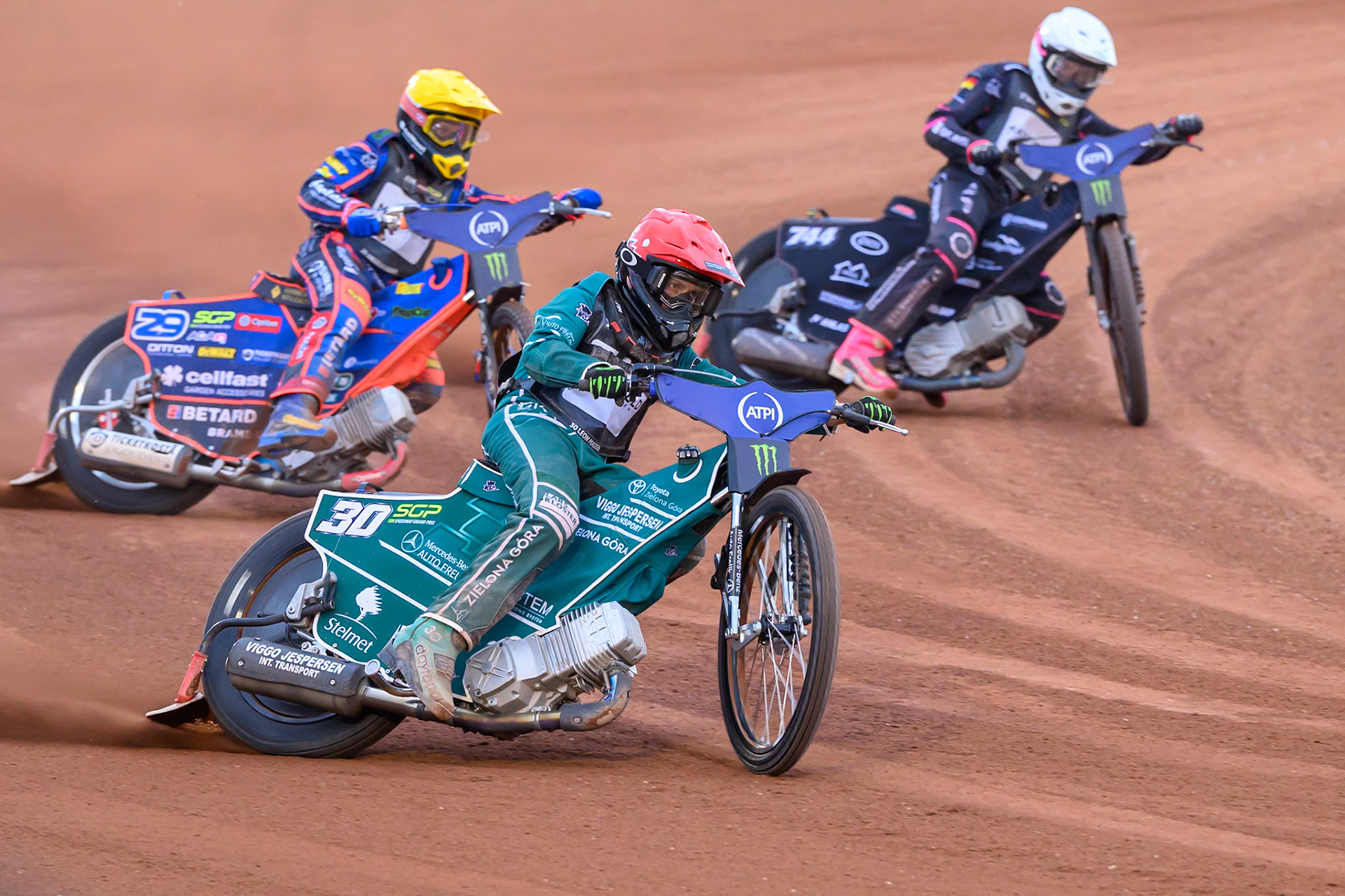 Leon Madsen (30) of Denmark in Red leadingAndzejs Lebedevs (29) of Latvia in Yellow and Kai Huckenbeck (744) of Germany in White during the ATPI  FIM Speedway GP of Manchester at the National Speedway Stadium, Manchester on Friday 5th June 2026. (Photo: Ian Charles | MI News)