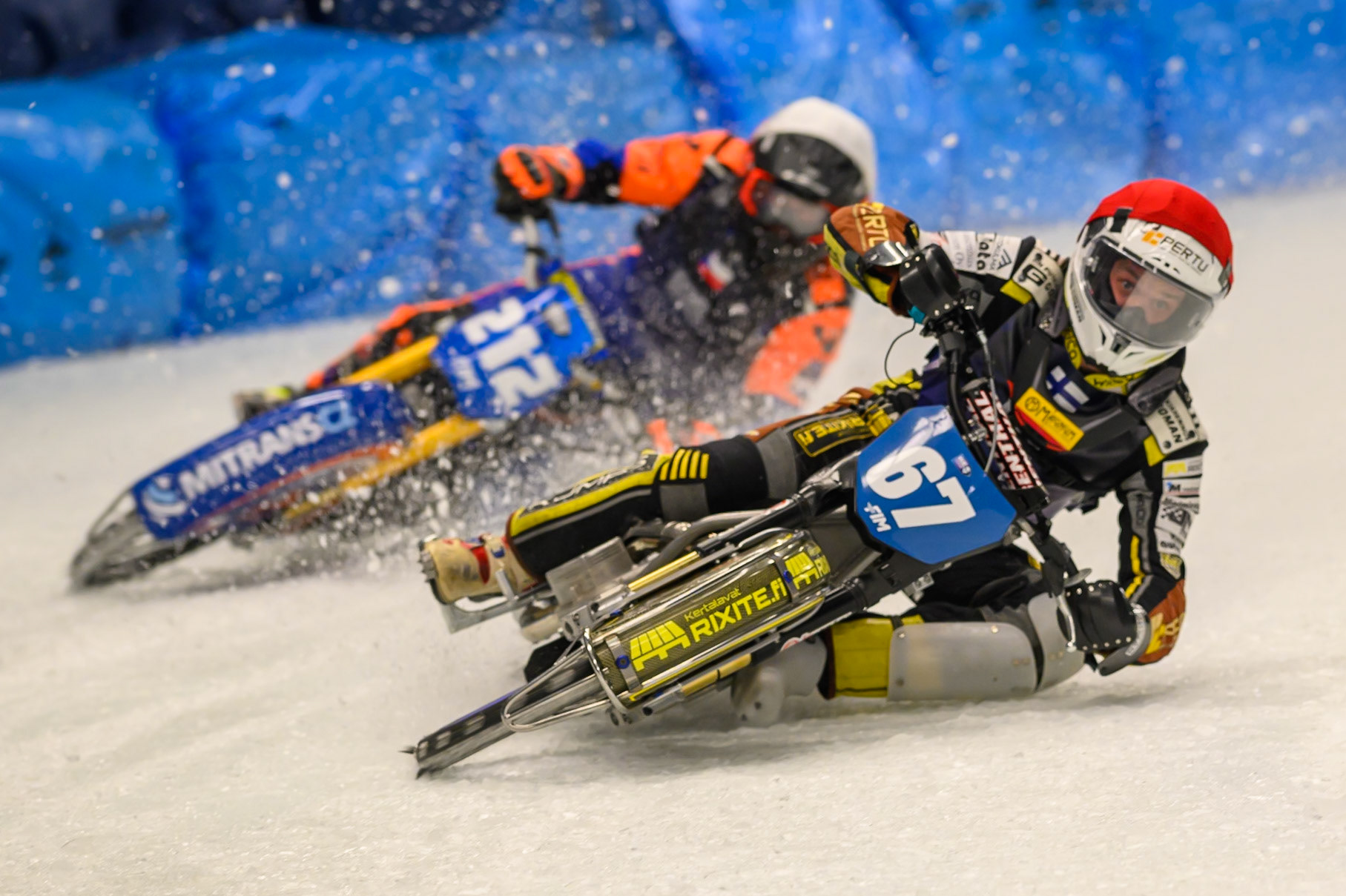 Heikki Huusko (67) of Finland  in Red leading Lukas Hutla (212) of Czechia  in White during the Ice Speedway Gladiators World Championship Final 1 at Max-Aicher-Arena, Inzell on Saturday 14th March 2026. (Photo: Ian Charles | MI News)