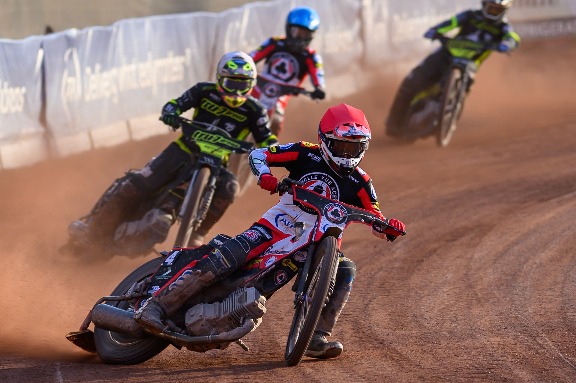 Zach Cook of Belle Vue Aces in Red leading Richard Lawson of Ipswich Witches in White and Tate Zischke of Belle Vue Aces in Blue during the Rowe Motor Oil Premiership match between Belle Vue Aces and Ipswich Witches at the National Speedway Stadium, Manchester on Saturday 20th June 2026. (Photo: Ian Charles | MI News)
