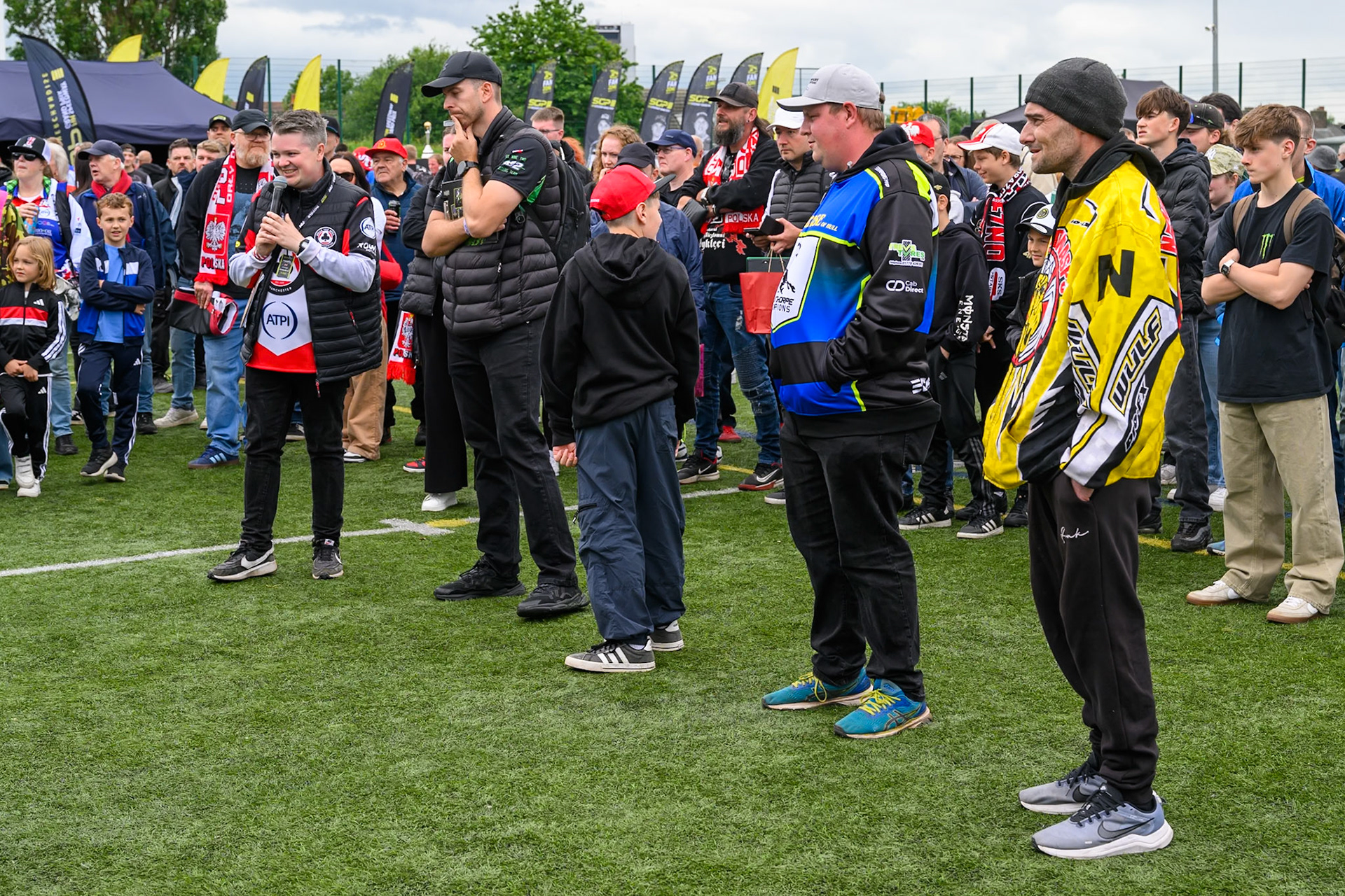 FanZone host Lee Wild (far left) with some quiz contestants in the FanZone during the ATPI  FIM Speedway GP of Manchester at the National Speedway Stadium, Manchester on Saturday 6th June 2026. (Photo: Ian Charles | MI News)