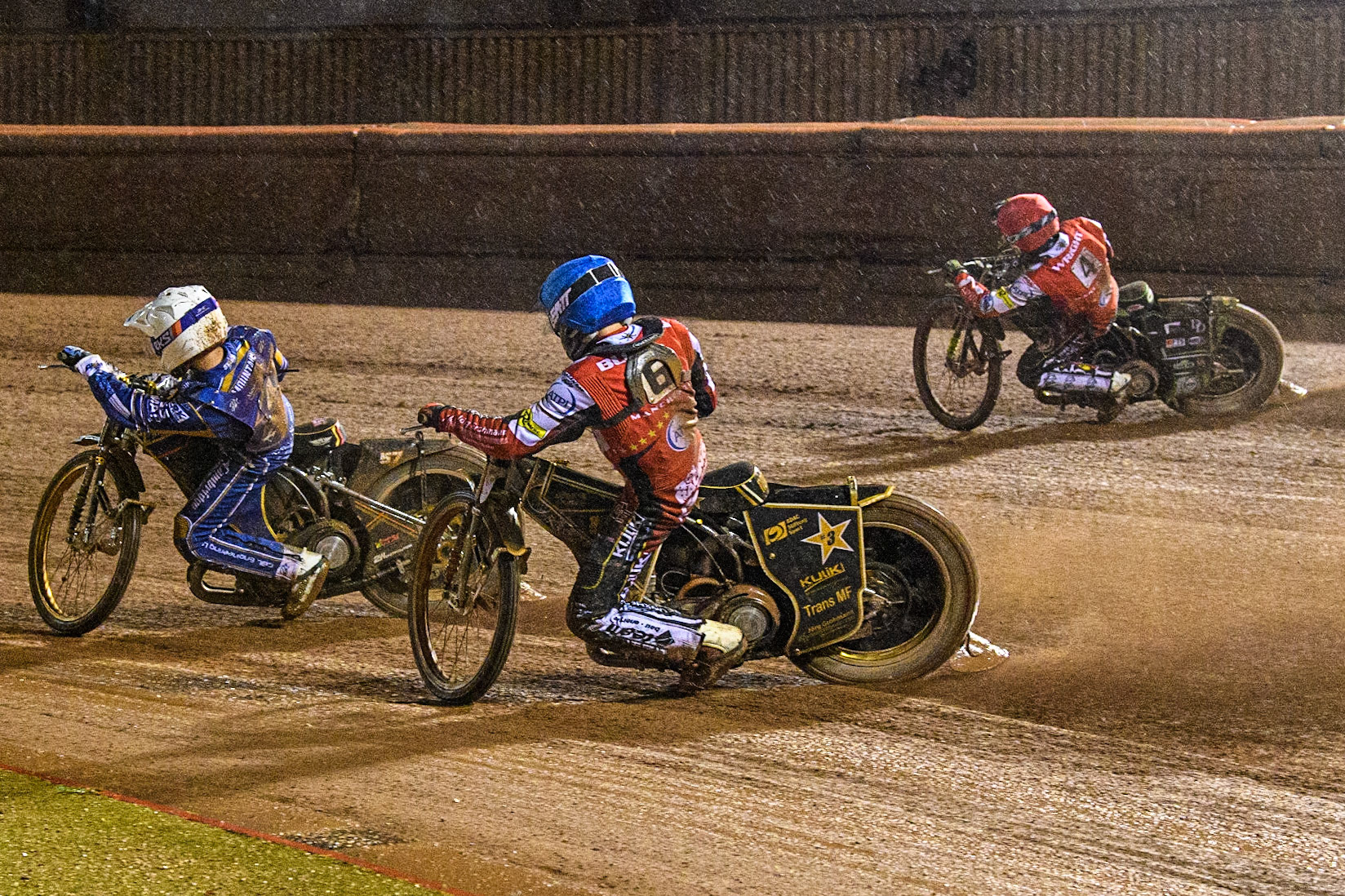 Norick Blodorn (Blue) chases Connor Mountain (White) with Charles Wright (Red) on the outside during the Sports Insure Premiership match between Belle Vue Aces and King's Lynn Stars at the National Speedway Stadium, Manchester on Monday 21st August 2023. (Photo: Ian Charles | MI News)