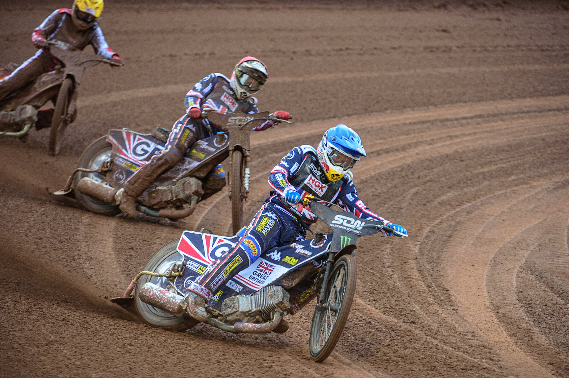 MANCHESTER, UK. OCT 17TH Robert Lambert of Great Britain (Blue) leads Dan Bewley of Great Britain (Red) and Maciej Janowski of Poland (Yellow) during the Monster Energy FIM Speedway of Nations at the National Speedway Stadium, Manchester on Sunday  17th October 2021. (Credit: Ian Charles | MI News)