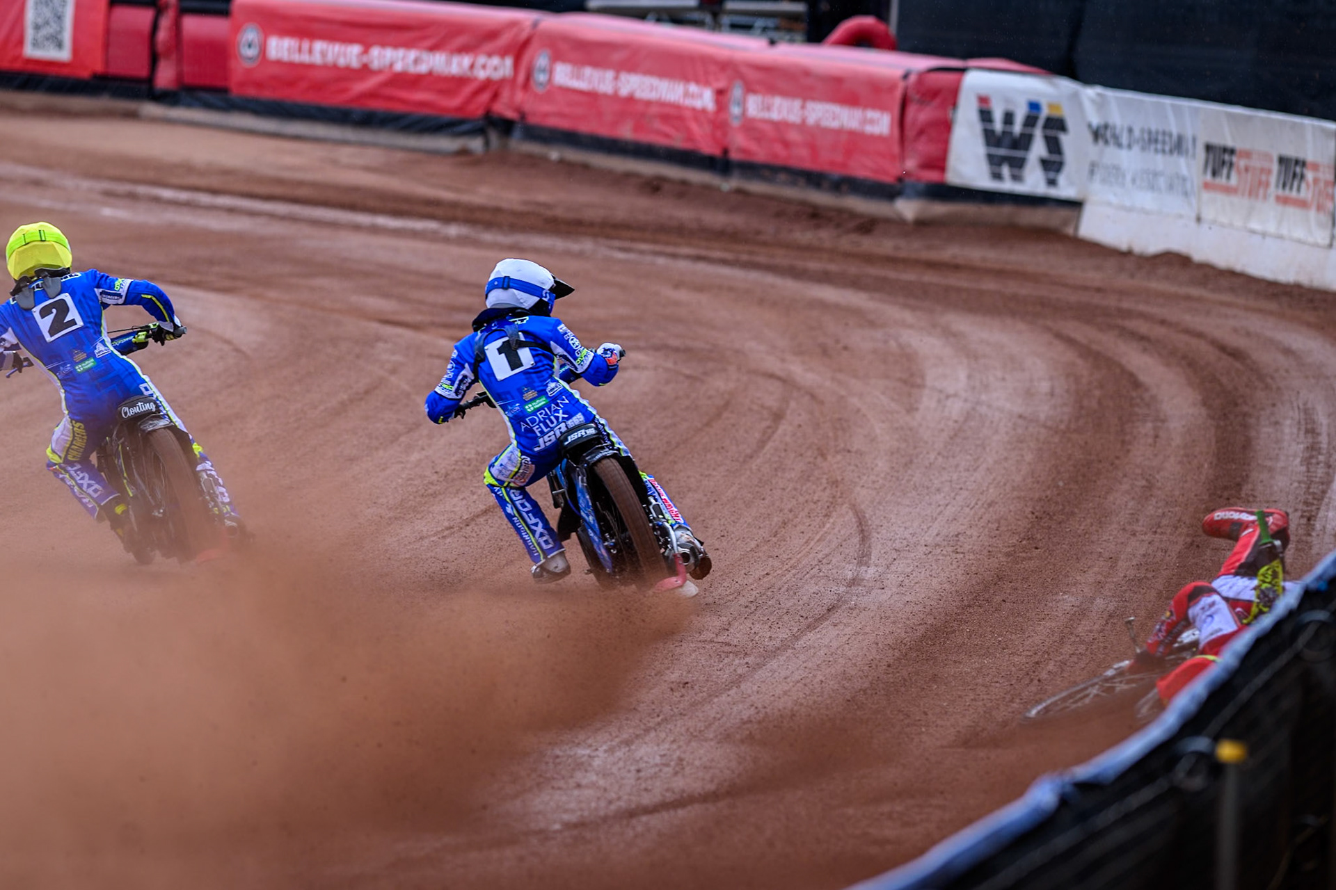 Belle Vue Colts' William Cairns falls whilst trying to pass Oxford Chargers' Jody Scott  in White and Oxford Chargers' Jacob Clouting  in Yellow during the WSRA National Development League match between Belle Vue Colts and Oxford Chargers at the National Speedway Stadium, Manchester on Sunday 1st June 2025. (Photo: Ian Charles | MI News)