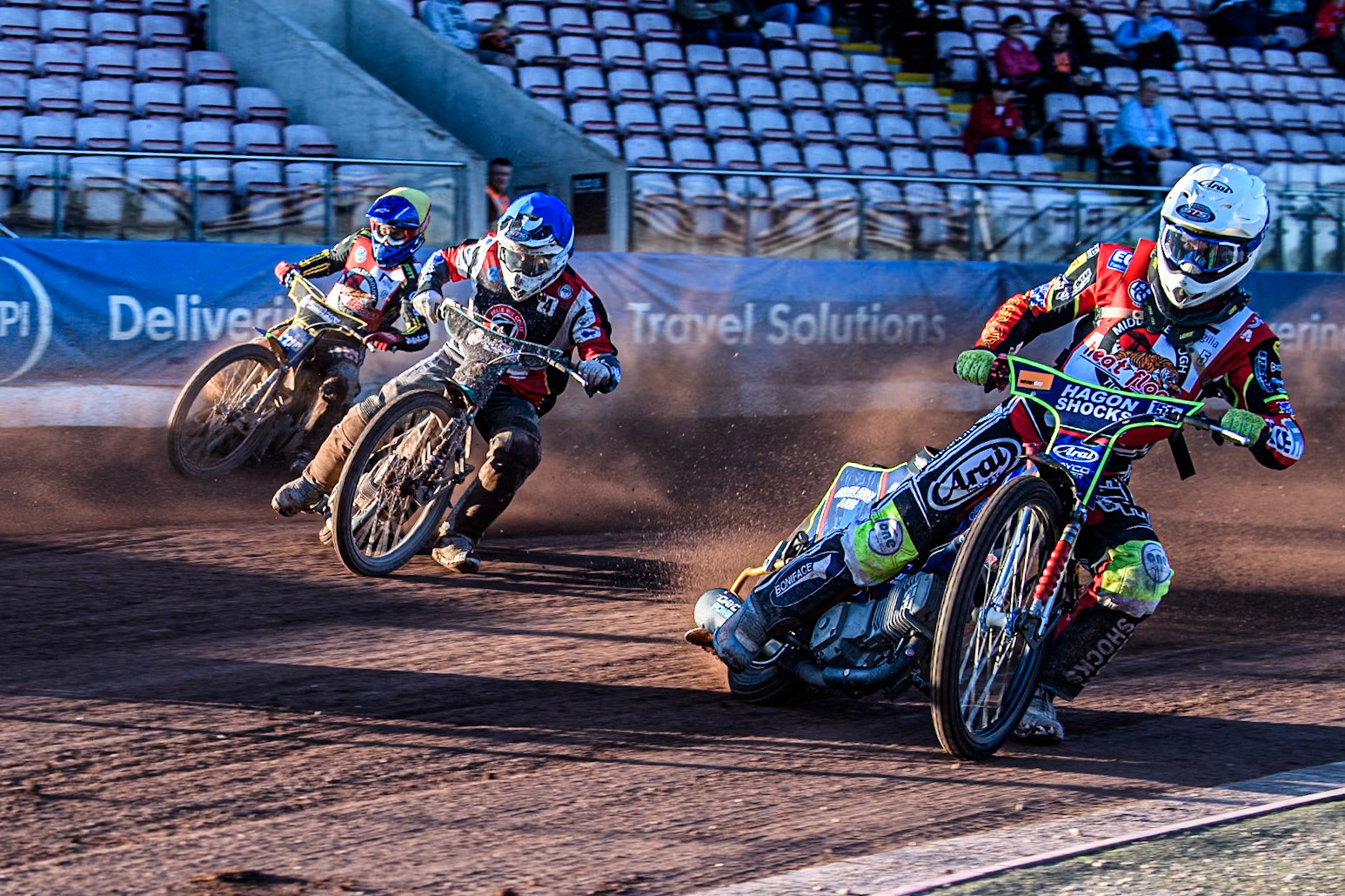 Middlesbrough Tigers' Jake Mulford in White leading Belle Vue Colts' Guest rider Mason Watson in Blue and Middlesbrough Tigers' William Hocaniuk in Yellow during the WSRA National Development League match between Belle Vue Colts and Middlesbrough Tigers at the National Speedway Stadium, Manchester on Monday 17th June 2024. (Photo: Ian Charles | MI News)