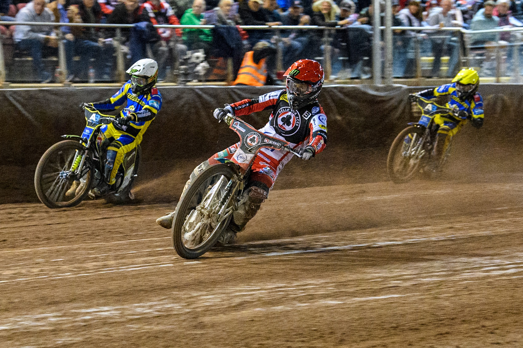 Belle Vue Aces' Jaimon Lidsey  in Red leading Sheffield Tigers' Chris Holder  in White and Sheffield Tigers' Jack Holder  in Yellow during the Rowe Motor Oil Premiership Play Off Semi Final 2, 1st Leg match between Belle Vue Aces and Sheffield Tigers at the National Speedway Stadium, Manchester on Monday 16th September 2024. (Photo: Ian Charles | MI News)