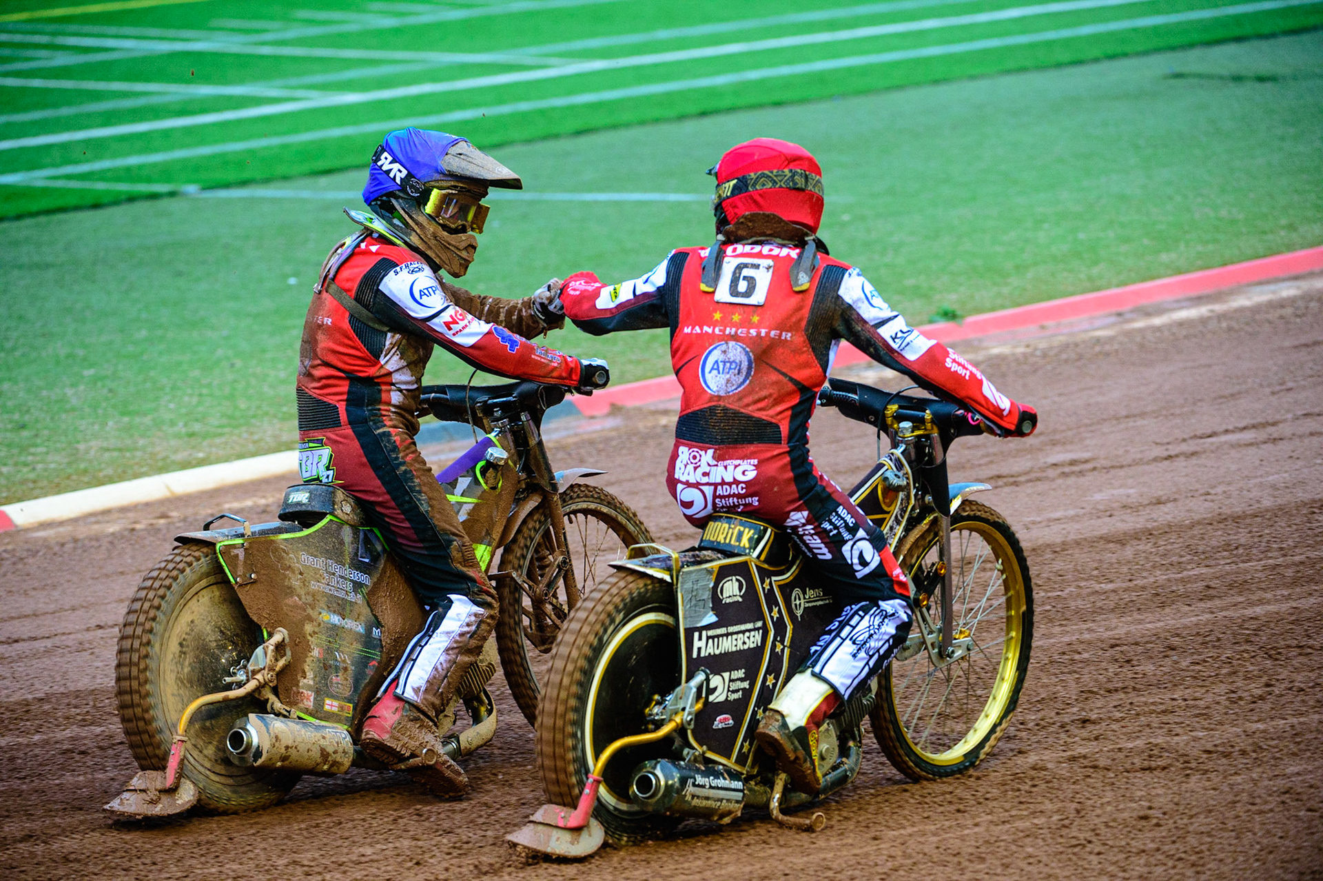 MANCHESTER, UK. MAY 16TH Norick Blödorn  (Red) and Tom Brennan   (Blue) congratulate each other after their 5-1 heat win during the SGB Premiership match between Belle Vue Aces and King's Lynn Stars at the National Speedway Stadium, Manchester on Monday 16th May 2022. (Credit: Ian Charles | MI News)