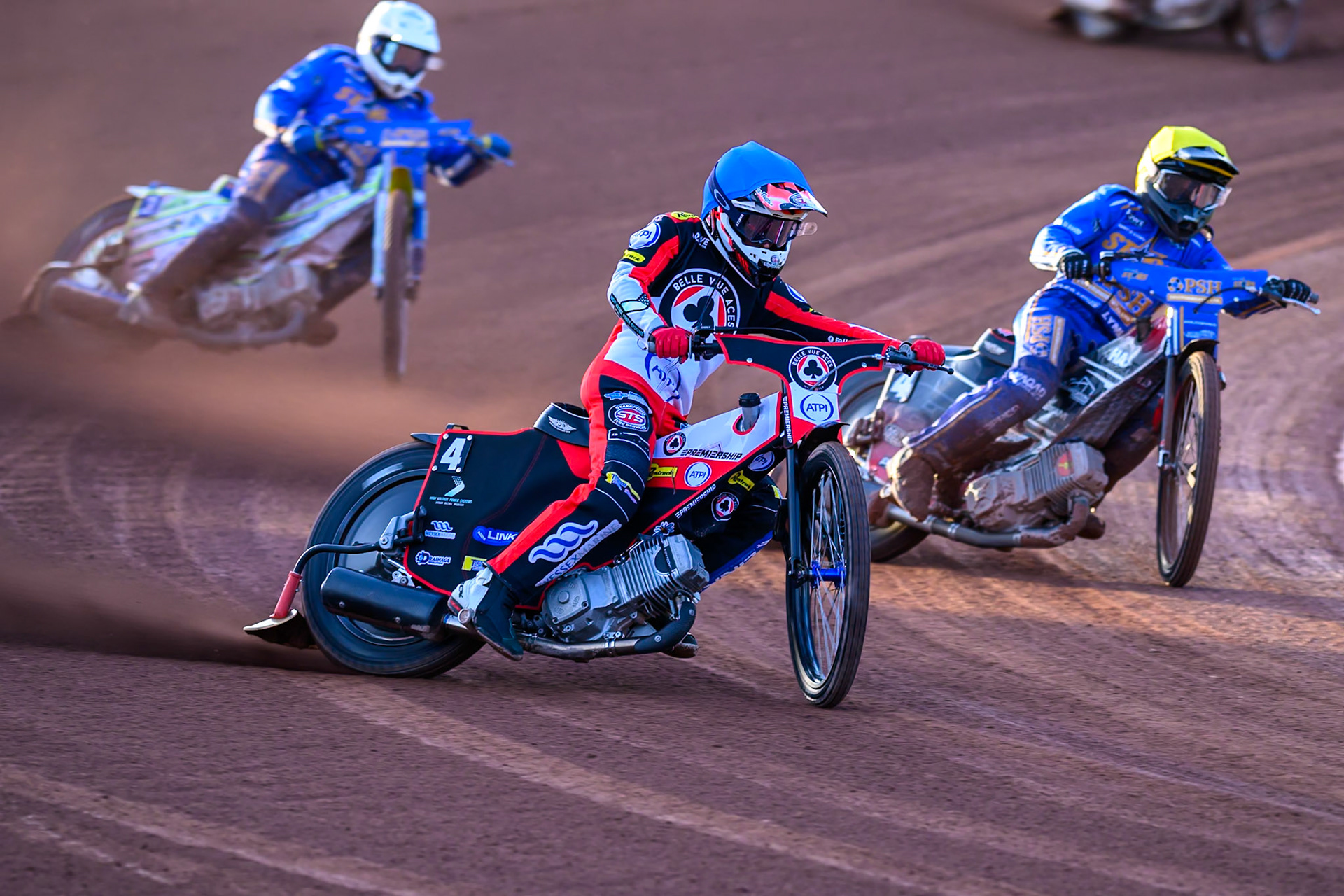 Zach Cook of Belle Vue Aces in Blue rides outside Ben Cook of Kings Lynn Stars in Yellow with Chris Harris of Kings Lynn Stars in White  behind during the Rowe Motor Oil Premiership match between Belle Vue Aces and King's Lynn Stars at the National Speedway Stadium, Manchester on Monday 10th August 2026. (Photo: Ian Charles | MI News)