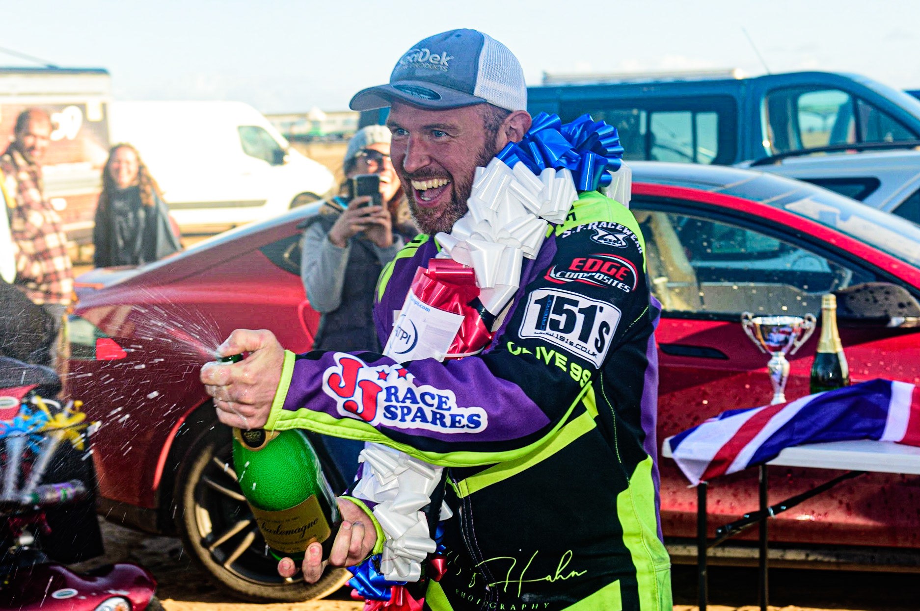Paul Cooper (11) sprays the champagne during the Fylde ACU British Sand Racing Masters Championship on  Sunday 2nd October 2022. (Credit: Ian Charles | MI News)