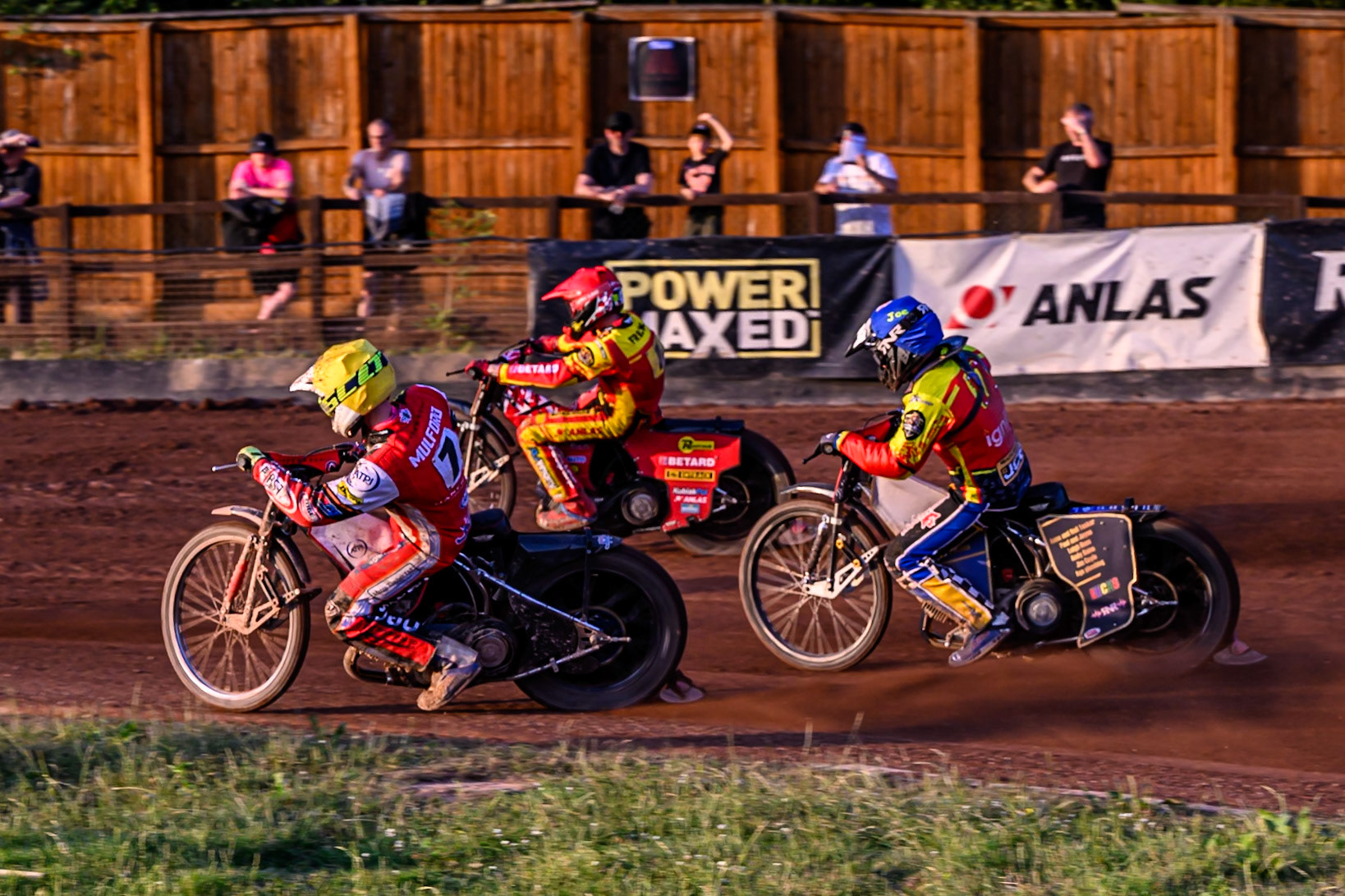 Belle Vue Aces' Jake Mulford in Yellow rides inside Leicester Lions' Max Fricke in Red and Leicester Lions' Joe Thompson in Blue during the Rowe Motor Oil Premiership match between Leicester Lions and Belle Vue Aces at the Hydroscand Arena, Leicester on Thursday 19th June 2025. (Photo: Ian Charles | MI News)