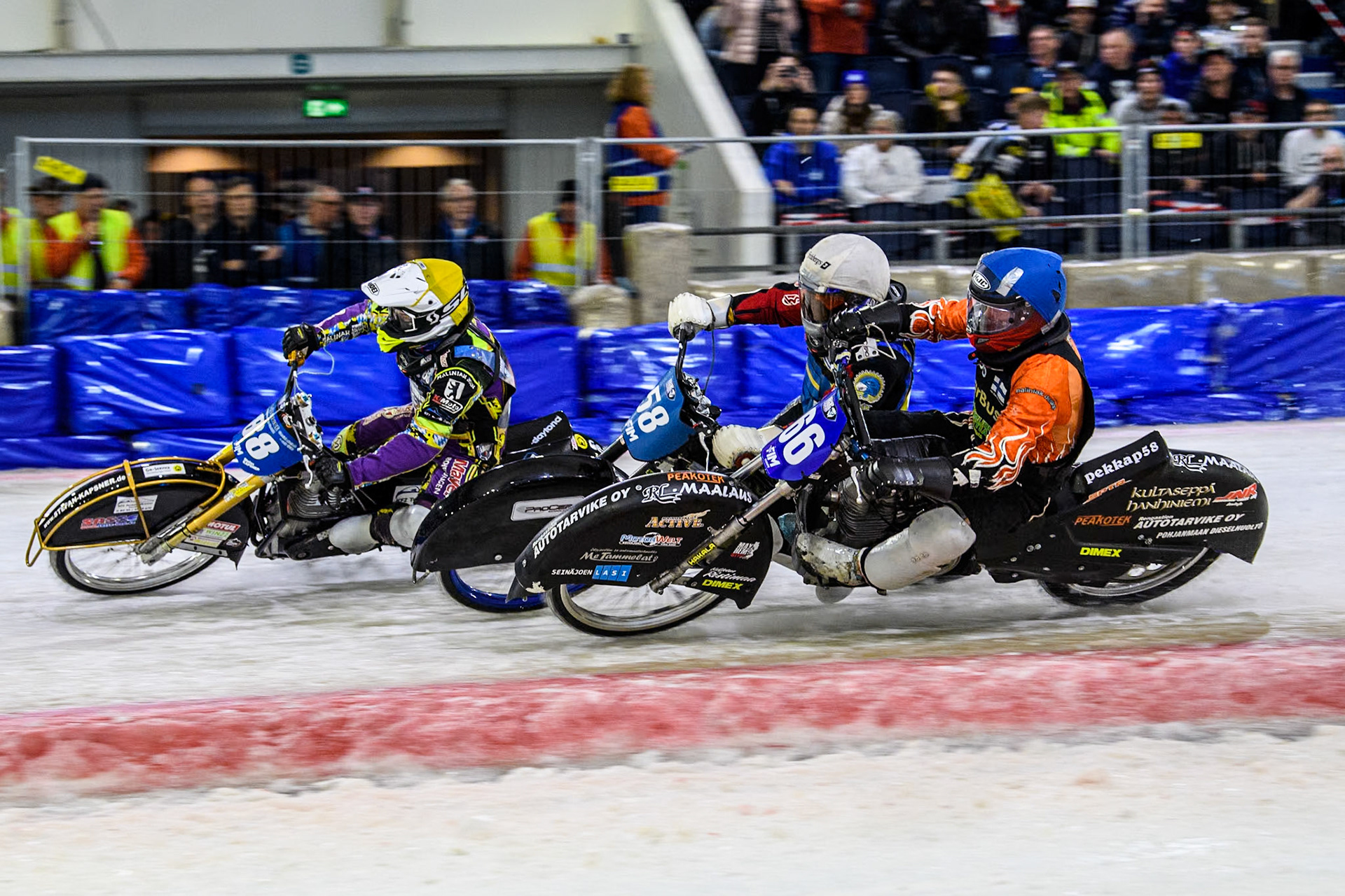 Finland's Aki Ala-Riihimäki (66) in Blue rides inside Sweden's Stefan Svensson (58) in White and Germany's Max Niedermaier (88) in Yellow during the FIM Ice Speedway Gladiators World Championship Final 4 at Ice Rink Thialf, Heerenveen on Sunday 7th April 2024. (Photo: Ian Charles | MI News)