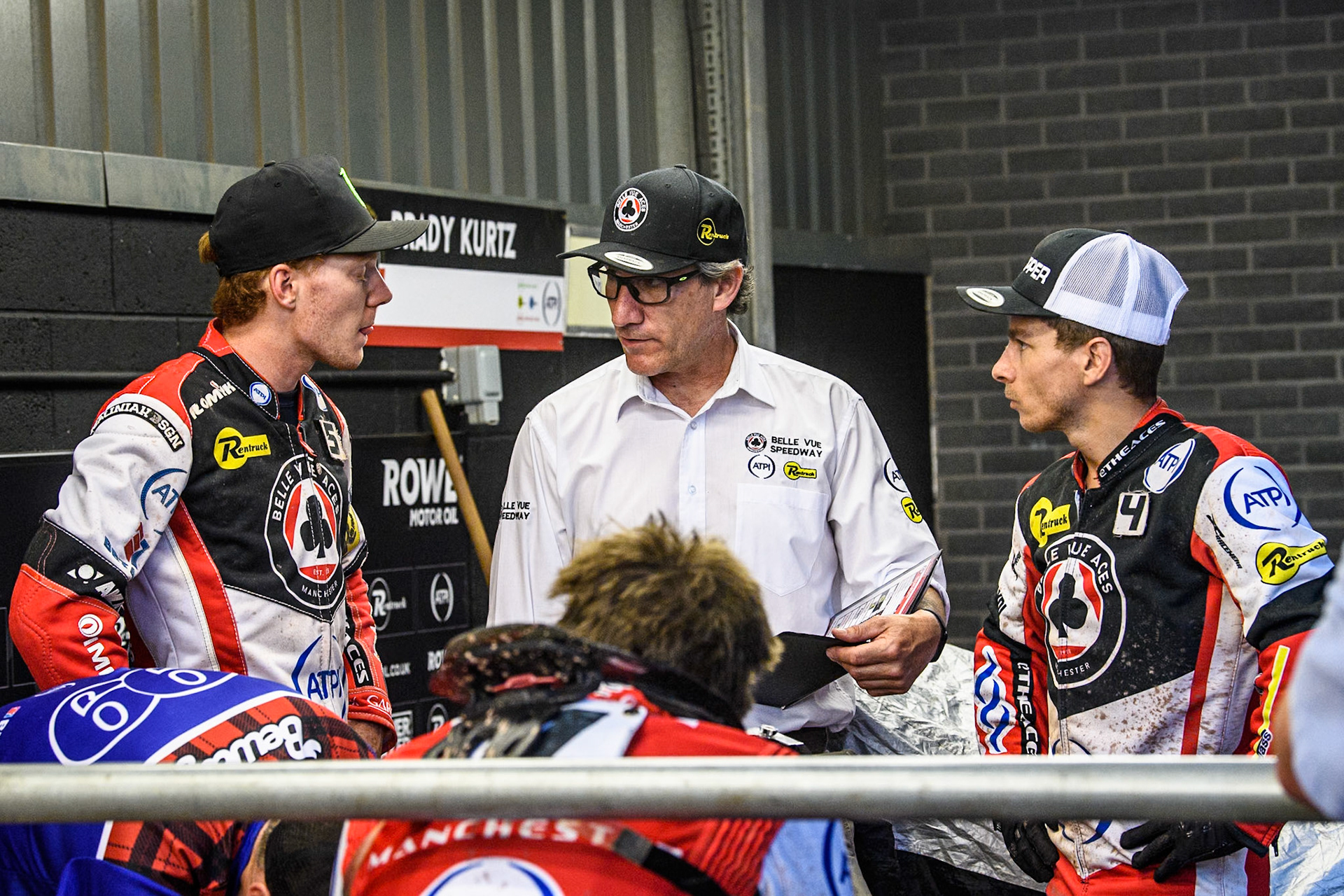 (L to R) Belle Vue Aces' Dan Bewley, Belle Vue Aces' Team Manager Mark Lemon and Belle Vue Aces' Ben Cook during the Rowe Motor Oil Premiership match between Belle Vue Aces and Leicester Lions at the National Speedway Stadium, Manchester on Monday 24th June 2024. (Photo: Ian Charles | MI News)