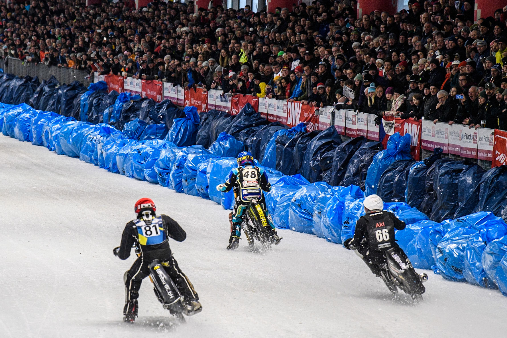 Jimmy Olsén (81) of Sweden in Red chases Aki Ala-Riihimäki (66) of Finland in White and Luca Bauer (48) of Germany in Blue during the Ice Speedway Gladiators World Championship Final 2 at Max-Aicher-Arena, Inzell on Sunday 16th March 2025. (Photo: Ian Charles | MI News)