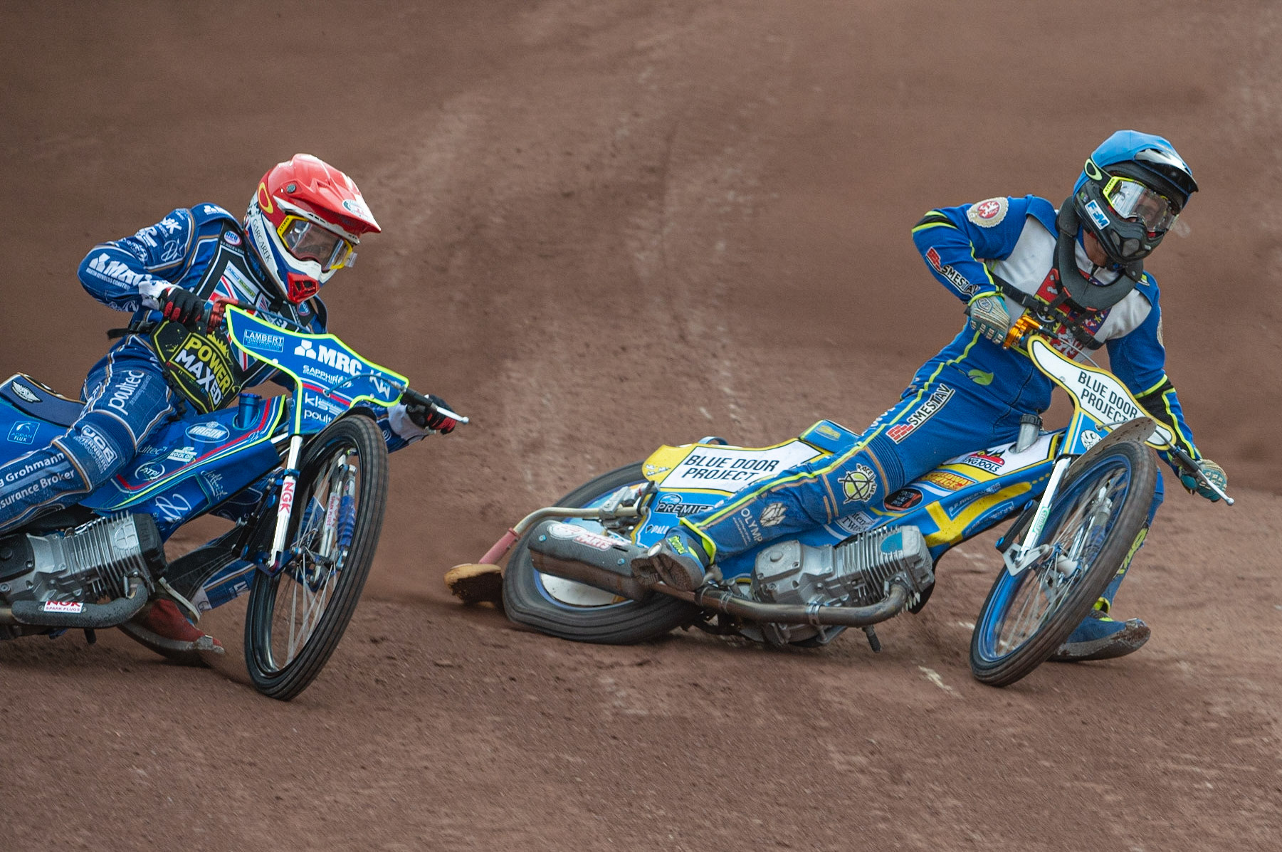 Photo by Ian Charles:

Ondrej Smetana  (Blue) inside Robert Lambert (Red)

FIM Speedway Grand Prix World Championship - Qualifying Round 1, Peugeot Ashfield Stadium, Glasgow, 8 June 2019