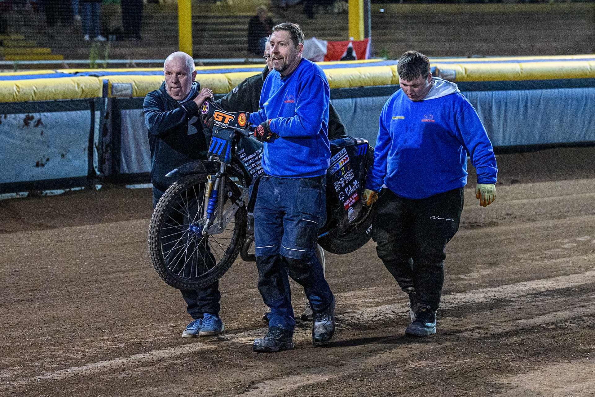 Mechanics and track staff carry Billy Budd’s bike back after his crash in heat 6 during the WSRA National Development League match between Steelers and Belle Vue Colts at Owlerton Stadium, Sheffield on Monday 5th May 2025. (Photo: Ian Charles | MI News)