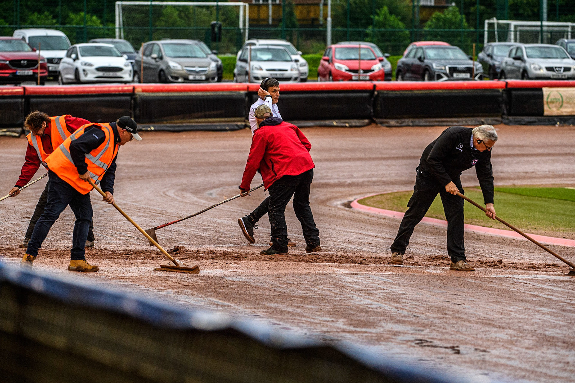 The track staff brush the water off the starting gates during the Sports Insure British Speedway Final at the National Speedway Stadium, Manchester on Monday 14th August 2023. (Photo: Ian Charles | MI News)
