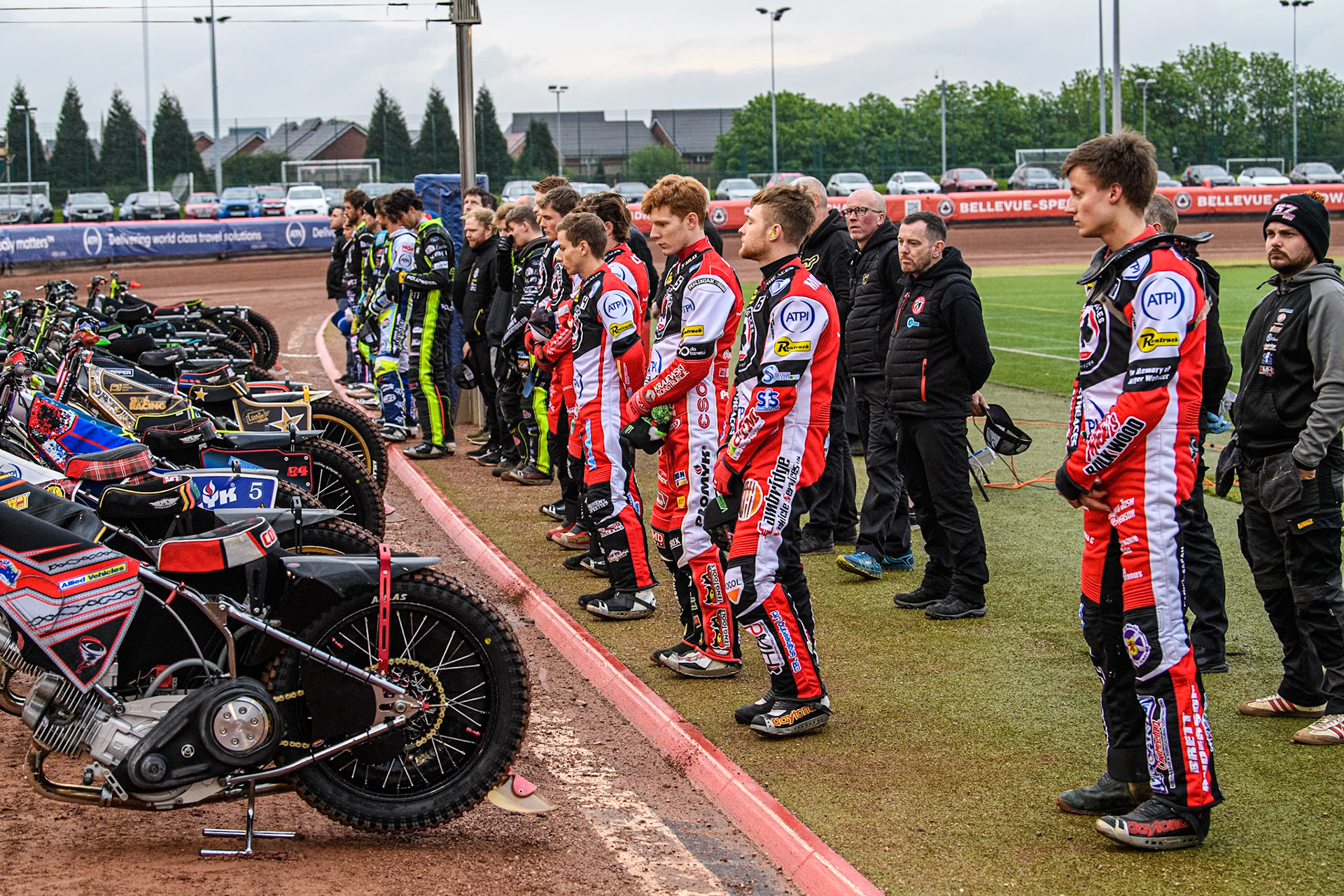 Both teams line up for the one minute’s silence in memory of  former Belle Vue Speedway announcer Ken Wrench during the Rowe Motor Oil Premiership match between Belle Vue Aces and Ipswich Witches at the National Speedway Stadium, Manchester on Monday 22nd April 2024. (Photo: Ian Charles | MI News)