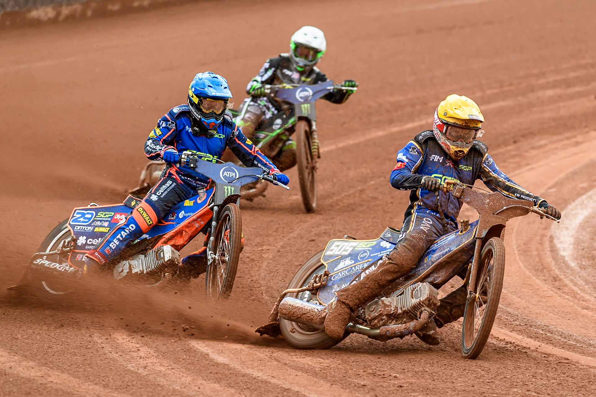Robert Lambert (505) of Great Britain in Yellow leading Andzejs Lebedevs (29) of Latvia in Blue and Wild Card Charles Wright (16) of Great Britain in White during the ATPI FIM Speedway Grand Prix Round 4 at the National Speedway Stadium, Manchester, on Friday 13th June 2025. (Photo: Ian Charles | MI News)