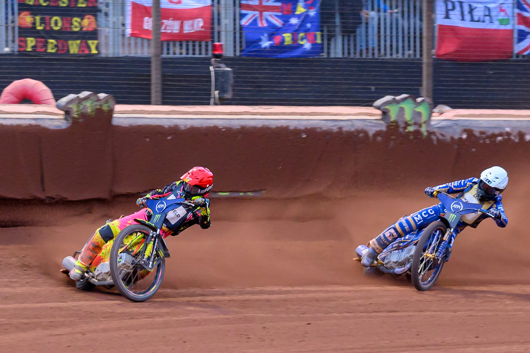Michael Jepsen Jensen (52) of Denmark in Red leading Bartosz Zmarzlik (95) of Poland in White during the ATPI  FIM Speedway GP of Manchester at the National Speedway Stadium, Manchester on Saturday 6th June 2026. (Photo: Ian Charles | MI News)