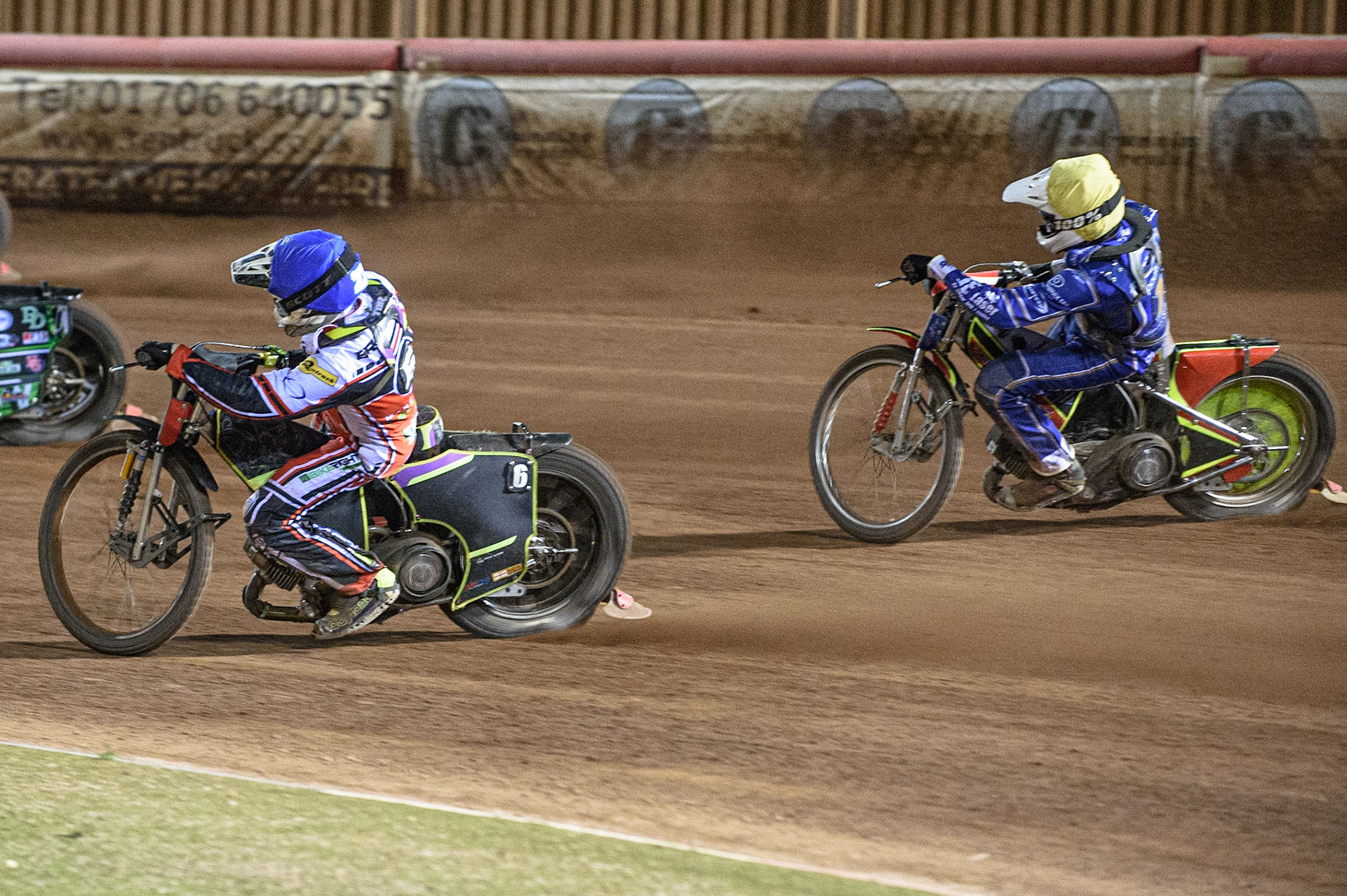 MANCHESTER, UK. AUGUST 23RD    Tom Brennan  (Blue) leads Kasper Andersen  (Yellow) during the SGB Premiership match between Belle Vue Aces and King's Lynn Stars at the National Speedway Stadium, Manchester on Monday 23rd August 2021. (Credit: Ian Charles | MI News)