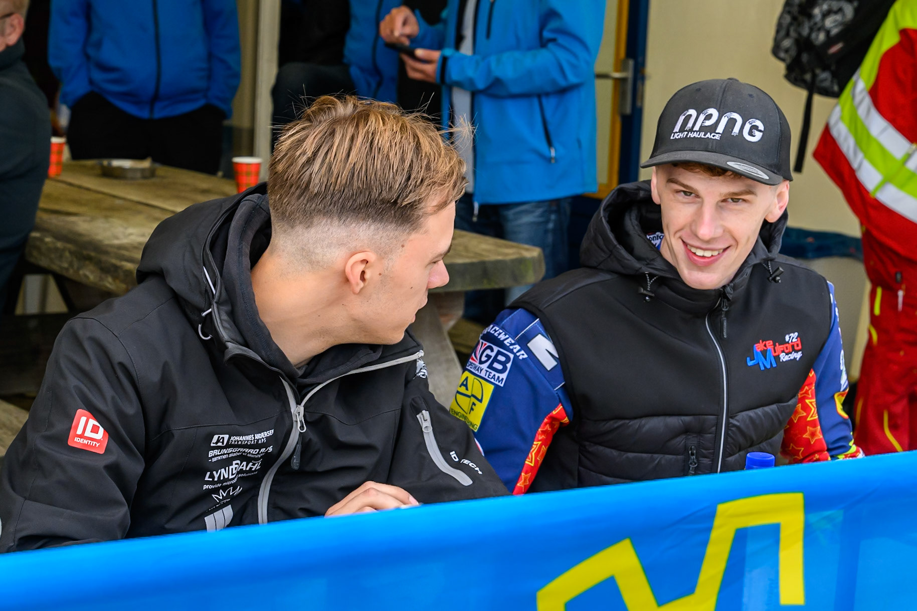 Mika Meijer (54) of The Netherlands (Left) with Jake Mulford (72) of Great Britain during the autograph session during the FIM Long Track World Championship Final 4, at the Speed Centre Roden, Netherlands on Sunday 21st September 2025. (Photo: Ian Charles | MI News)