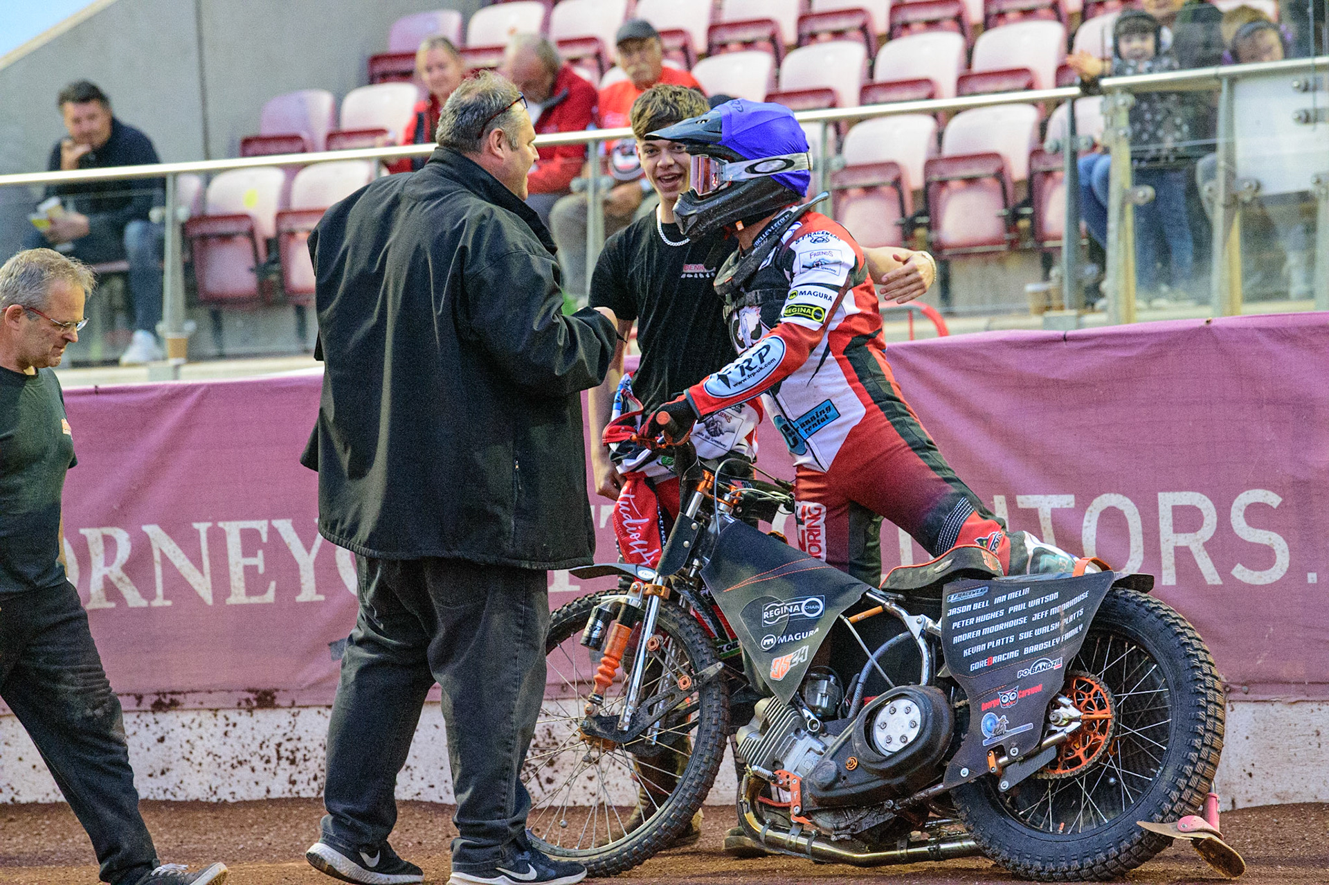 MANCHESTER, UK. JUN 24TH  Belle Vue Cool Running Colts  team manager Steve Williams (left) and Freddy Hodder  (centre) congratulate Jack Smith  on his heat win during the National Development League match between Belle Vue Colts and Berwick Bullets at the National Speedway Stadium, Manchester on Friday 24th June 2022. (Credit: Ian Charles | MI News)