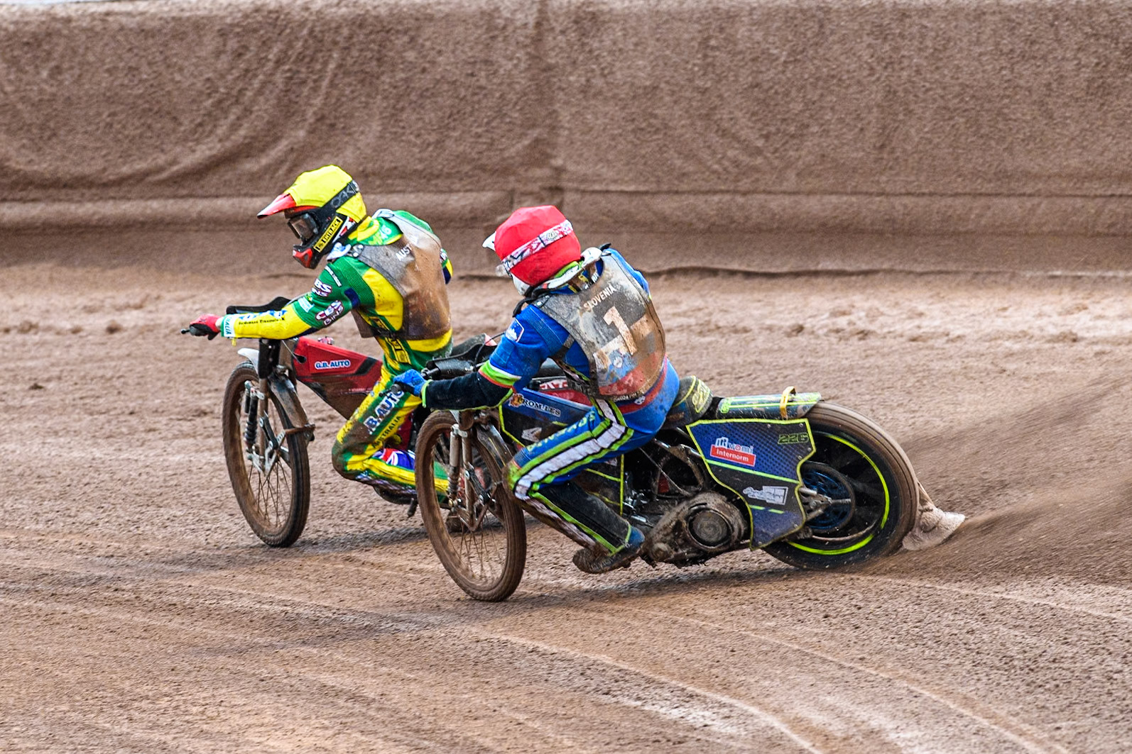 Anze Grmek of Slovenia in Red chases Max Fricke of Australia in Yellow during the Monster Energy FIM Speedway of Nation Semi Final 2 at the National Speedway Stadium, Manchester on Wednesday 10th July 2024. (Photo: Ian Charles | MI News)