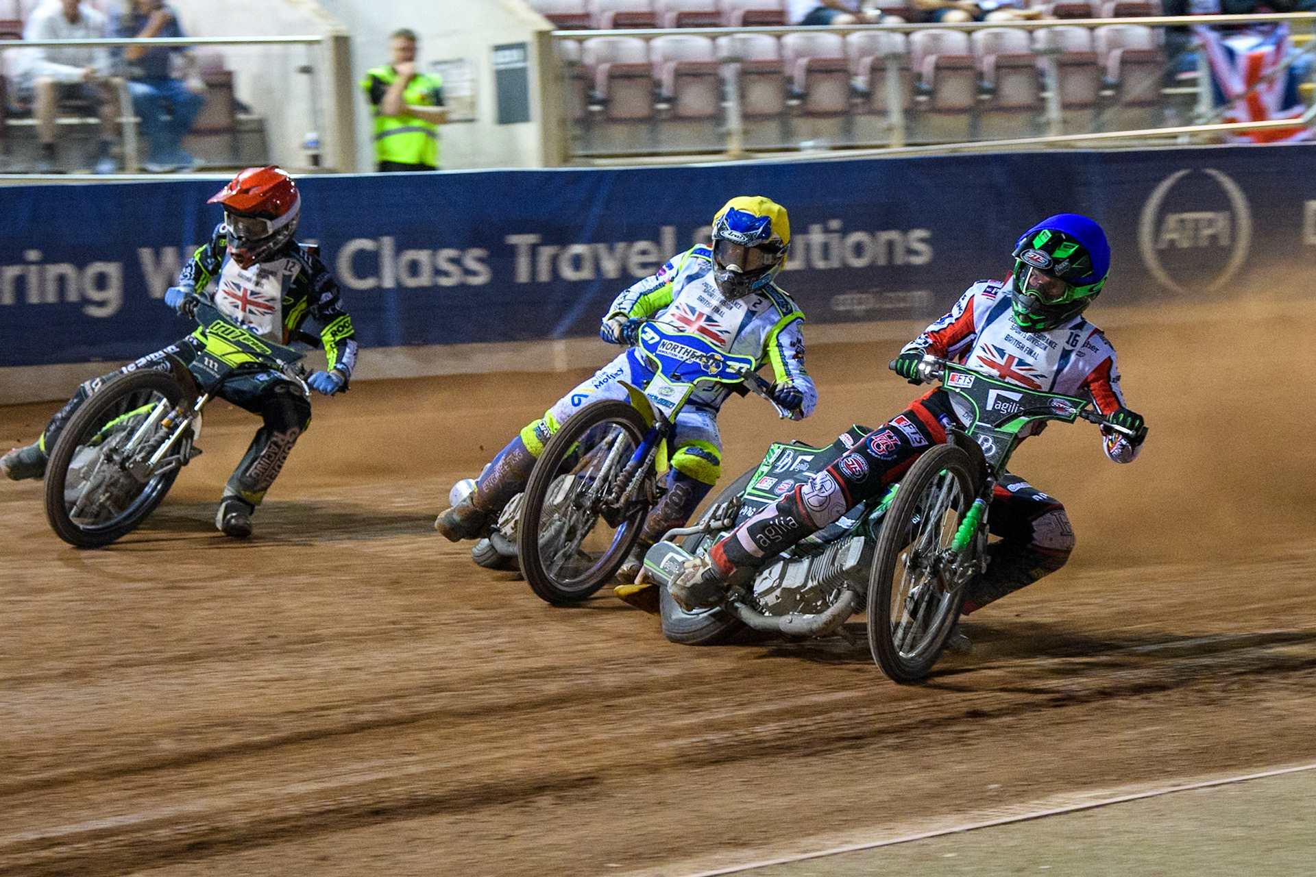 Charles Wright in Blue rides inside Chris Harris in Yellow and Adam Ellis in Red during the Attis Insurance Sports Division British Final at the National Speedway Stadium, Manchester on Monday 12th May 2025. (Photo: Ian Charles | MI News)