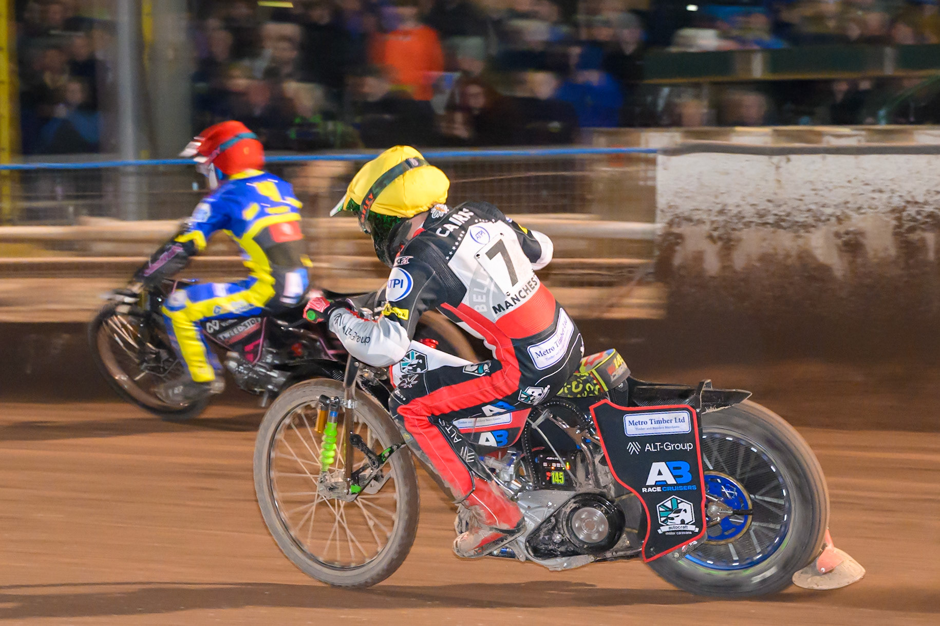 William Cairns of Belle Vue Aces  in Yellow chases Leon Flint of Sheffield Tigers   in Red during the Knockout Cup Northern Section match between Sheffield Tigers and Belle Vue Aces at Owlerton Stadium, Sheffield on Thursday 2nd April 2026. (Photo: Ian Charles | MI News)