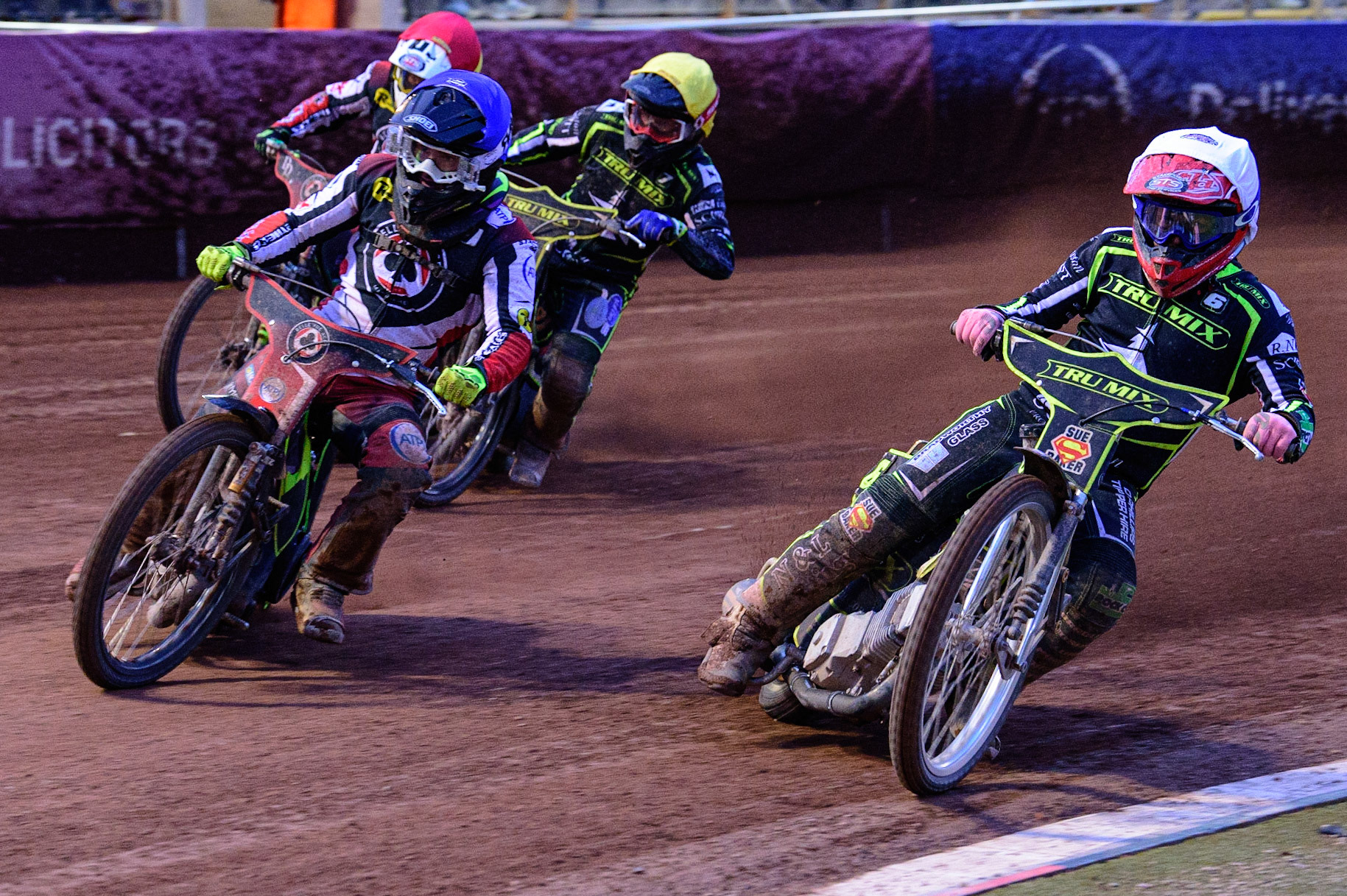 MANCHESTER, UK. JUN 6TH Tom Brennan  (Blue) outside Ben Barker  (White) with Danyon Hume  (Yellow) and Charles Wright  (Red) behind  during the SGB Premiership match between Belle Vue Aces and Ipswich Witches at the National Speedway Stadium, Manchester on Monday 6th June 2022. (Credit: Ian Charles | MI News)