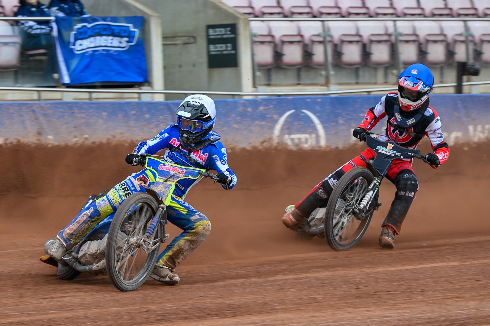 Oxford Chargers' Jody Scott  in White leading Belle Vue Colts' Freddy Hodder  in Blue during the WSRA National Development League match between Belle Vue Colts and Oxford Chargers at the National Speedway Stadium, Manchester on Sunday 1st June 2025. (Photo: Ian Charles | MI News)