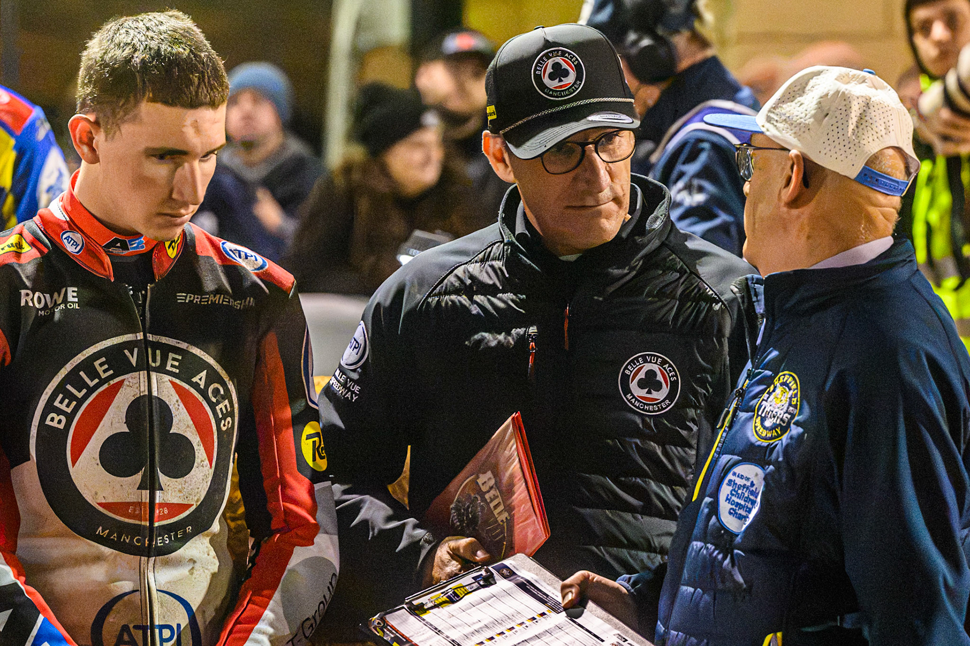 Mark Lemon, Team Manager of Belle Vue Aces (Centre) with Will Cairns of Belle Vue Aces (Left) chat with Sheffield Clerk Of The Course Neville Stanley (Right) during the Rowe Motor Oil Premiership Grand Final 1st Leg match between Sheffield Tigers and Belle Vue Aces at Owlerton Stadium, Sheffield on Monday 12th October 2026. (Photo: Ian Charles | MI News)