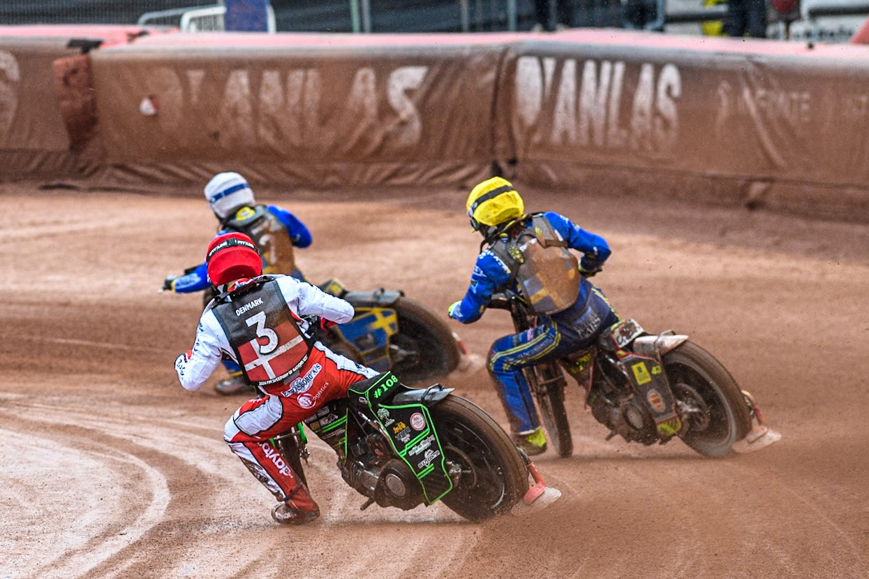 Villads Nagel of Denmark in Red chases Casper Henriksson of Sweden in Yellow and Philip Hellström-Bängs of Sweden in White during the Monster Energy FIM Speedway of Nations 2 (Under 21) Final at the National Speedway Stadium, Manchester on Friday 12th July 2024. (Photo: Ian Charles | MI News)