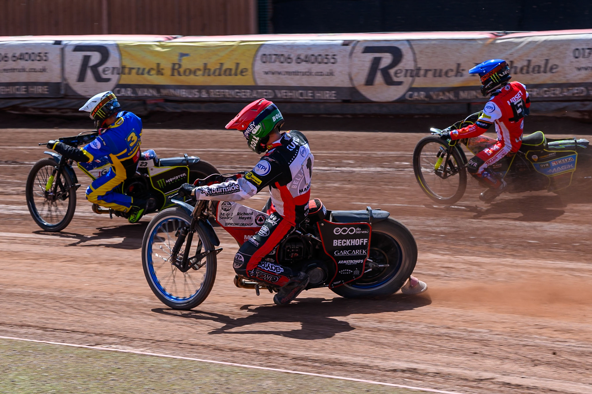 Brady Kurtz of Belle Vue Aces in Red and Jaimon Lidsey, Guest Rider for Belle Vue Aces in Blue chases Chris Holder of Sheffield Tigers in White during the Rowe Motor Oil Premiership match between Belle Vue Aces and Sheffield Tigers at the National Speedway Stadium, Manchester on Monday 25th May 2026. (Photo: Ian Charles | MI News)
