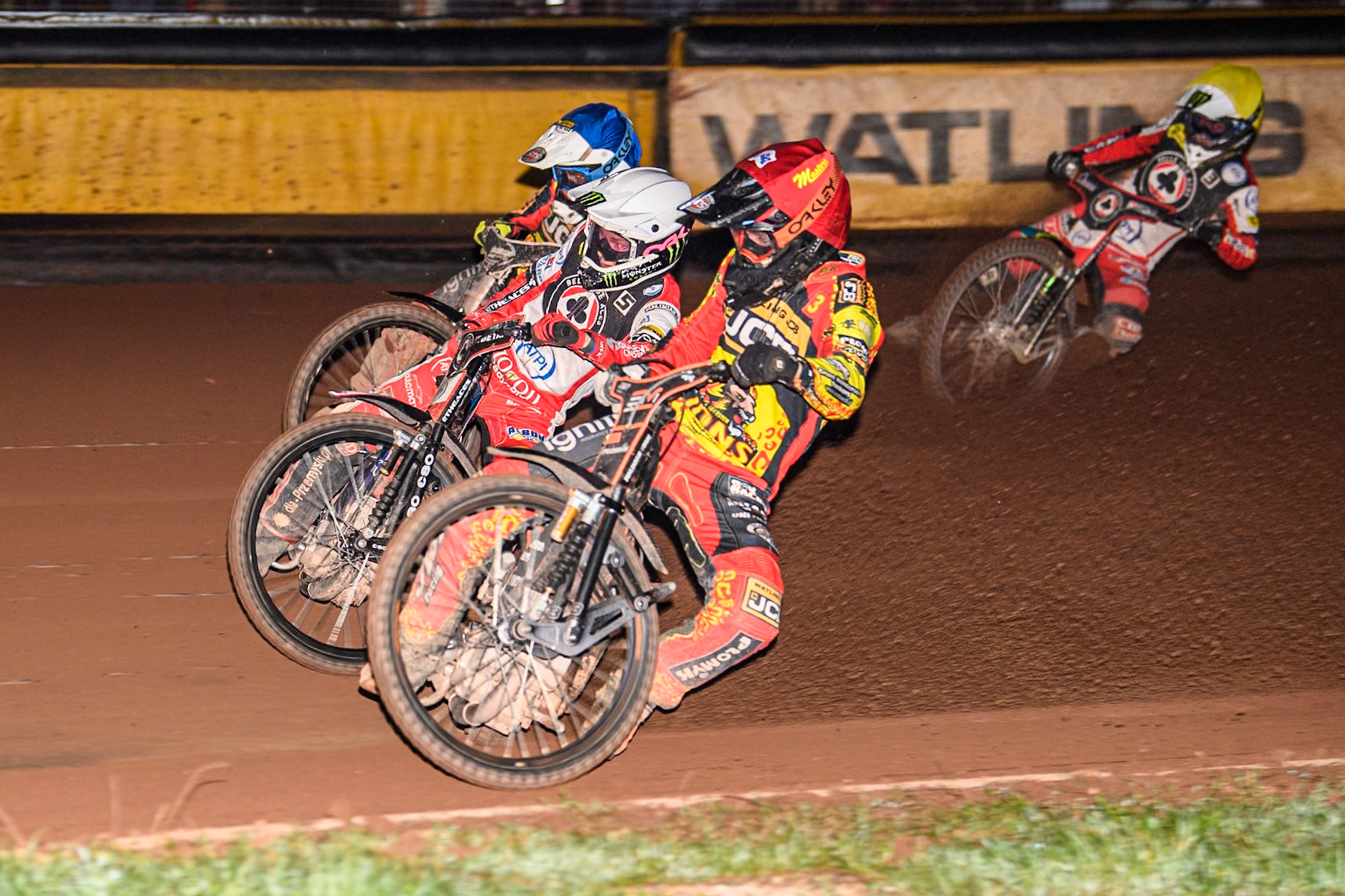 Leicester Lions' Sam Masters in Red rides inside Belle Vue Aces' Dan Bewley in White Leicester Lions' Richard Lawson in Blue with Belle Vue Aces' Jaimon Lidsey in Yellow behind during the Rowe Motor Oil Premiership Grand Final 2nd Leg between Leicester Lions and Belle Vue Aces at the Pidcock Motorcycles Arena, Leicester on Thursday 26th September 2024. (Photo: Ian Charles | MI News)