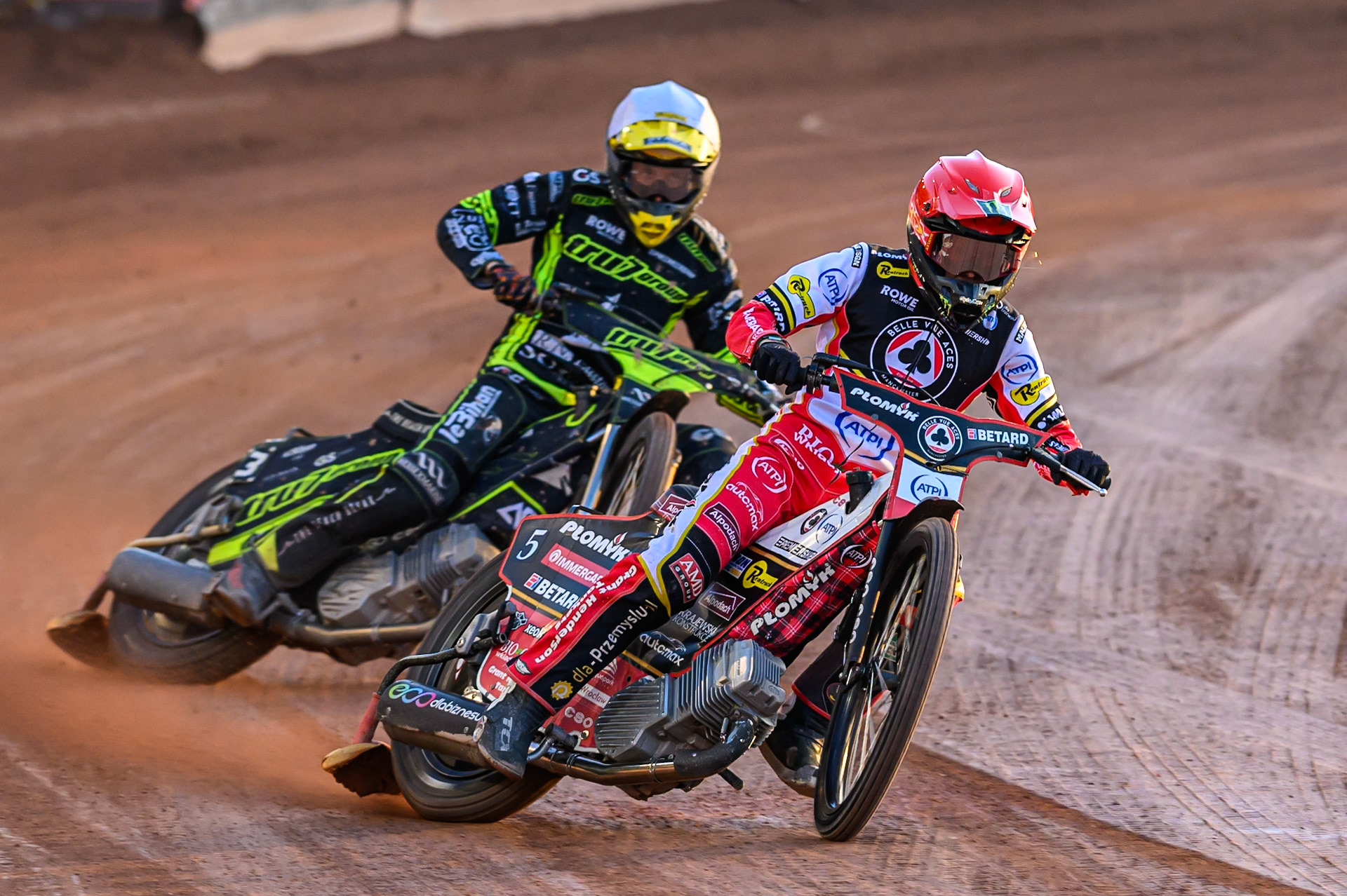 Dan Bewley of Belle Vue Aces  in Red leading Adam Ellis of Ipswich Witches  in White during the Rowe Motor Oil Premiership match between Belle Vue Aces and Ipswich Witches at the National Speedway Stadium, Manchester on Monday 4th August 2025. (Photo: Ian Charles | MI News)