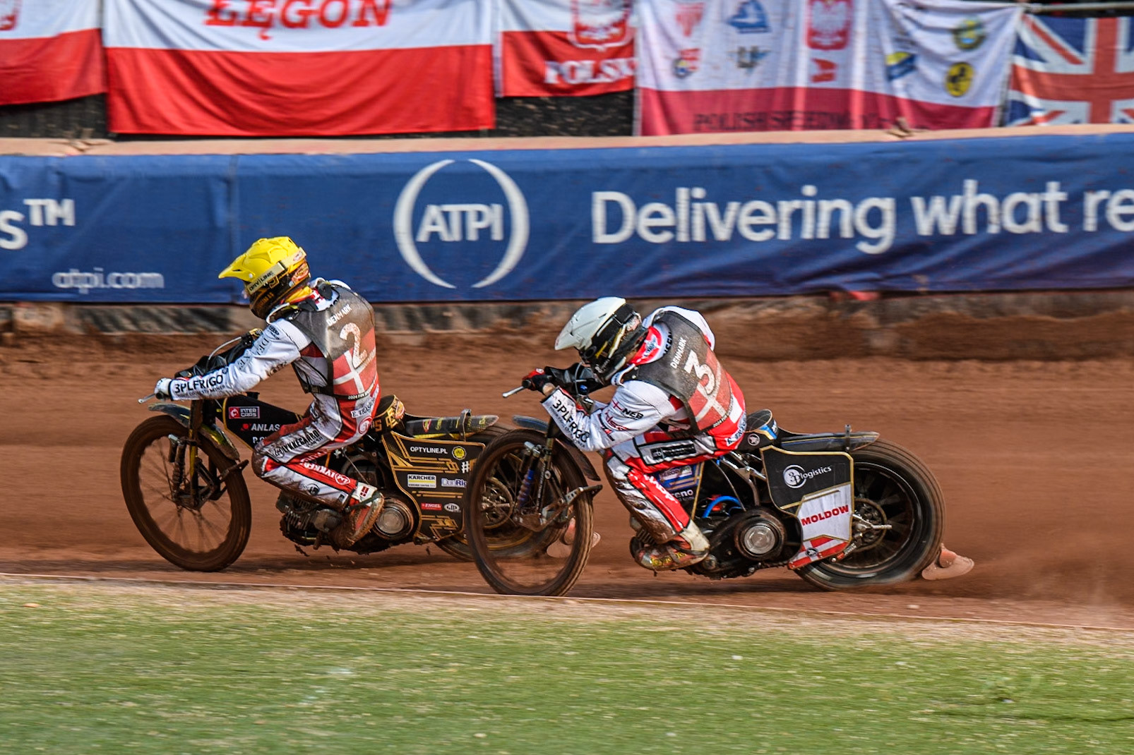 Anders Thomsen of Denmark in Yellow leading team mate Rasmus Jensen in White during the Monster Energy FIM Speedway of Nation Final at the National Speedway Stadium, Manchester on Saturday 13th July 2024. (Photo: Ian Charles | MI News)