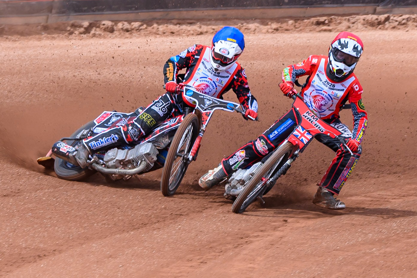 BRITISH YOUTH CHAMPIONSHIP (500cc): Kayden Mundy (8) in Red rides inside Dylan Huthwaite (9)  in Blue who then falls during the British Youth Speedway Championship at the National Speedway Stadium, Manchester on Sunday 10th May 2026. (Photo: Ian Charles | MI News)