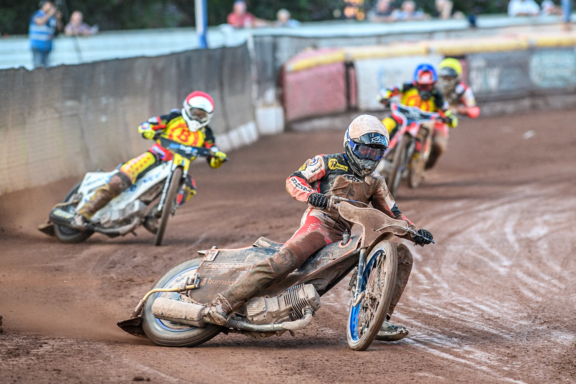 Belle Vue Aces' Brady Kurtz in White leading Birmingham Brummies' Wiktor Lampart in Red, Birmingham Brummies' Zach Cook in Blue and Belle Vue Aces' Norick Blodorn in Yellow during the Rowe Motor Oil Premiership match between Birmingham Brummies and Belle Vue Aces at Perry Bar Stadium, Birmingham on Monday 29th July 2024. (Photo: Ian Charles | MI News)