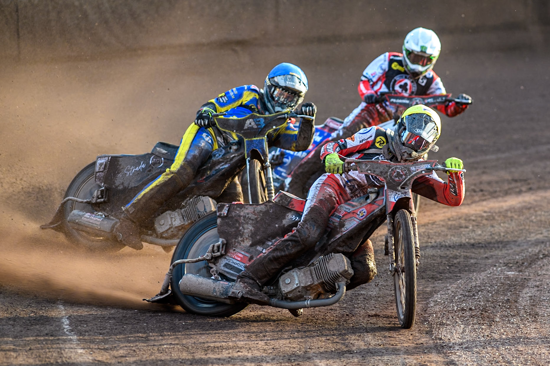 Belle Vue Aces' Connor Bailey  in Yellow leading Sheffield Tigers' Dan Gilkes  in Blue and Belle Vue Aces' Dan Bewley  in White during the Premiership KO Cup Quarter Final, 2nd Leg match between Sheffield Tigers and Belle Vue Aces at Owlerton Stadium, Sheffield on Thursday 9th May 2024. (Photo: Ian Charles | MI News)
