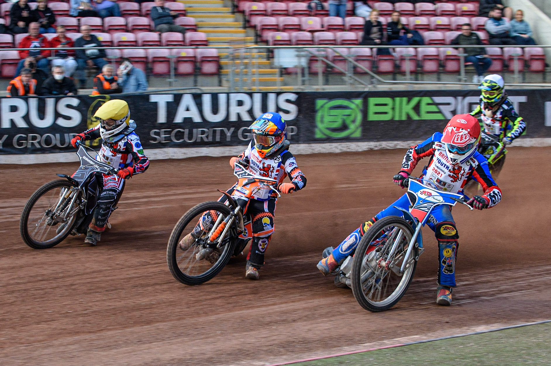 MANCHESTER, UK. MAY 28TH   500 CC Final: Cameron Taylor (Red) inside Ben Trigger (Blue)and Sam McGurk (Yellow) with Alex Goldsborough (White) behind  during the British Junior Championship at the National Speedway Stadium, Manchester on Friday 28th May 2021. (Credit: Ian Charles | MI News)