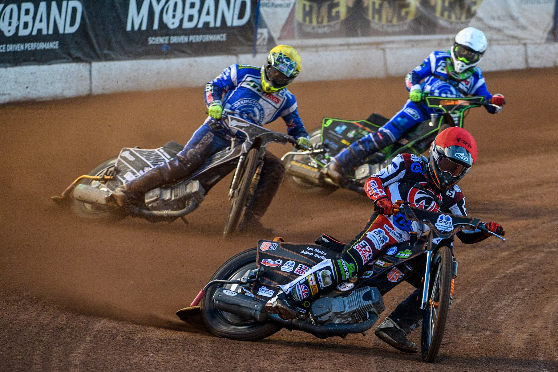 Jack Smith (Red) leads  Luke Crang (Yellow) and Luke Harrison (White) during the National Development League match between Belle Vue Colts and Workington Comets at the National Speedway Stadium, Manchester on Friday 25th August 2023. (Photo: Ian Charles | MI News)
